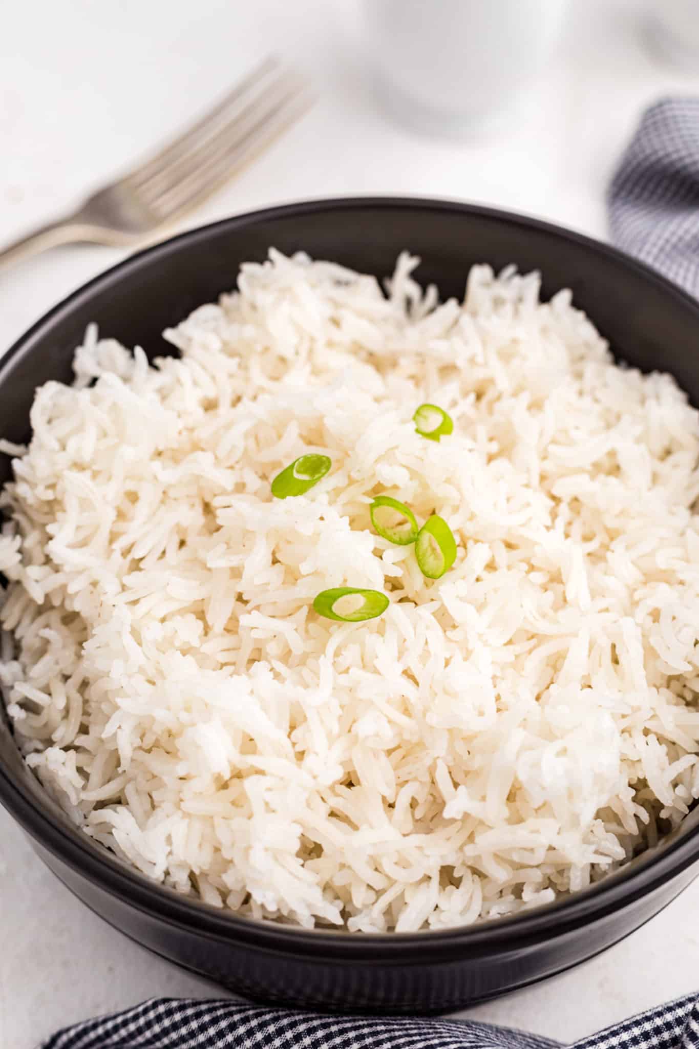 https://www.cleaneatingkitchen.com/wp-content/uploads/2021/11/cooked-basmati-rice-in-bowl-scaled.jpg