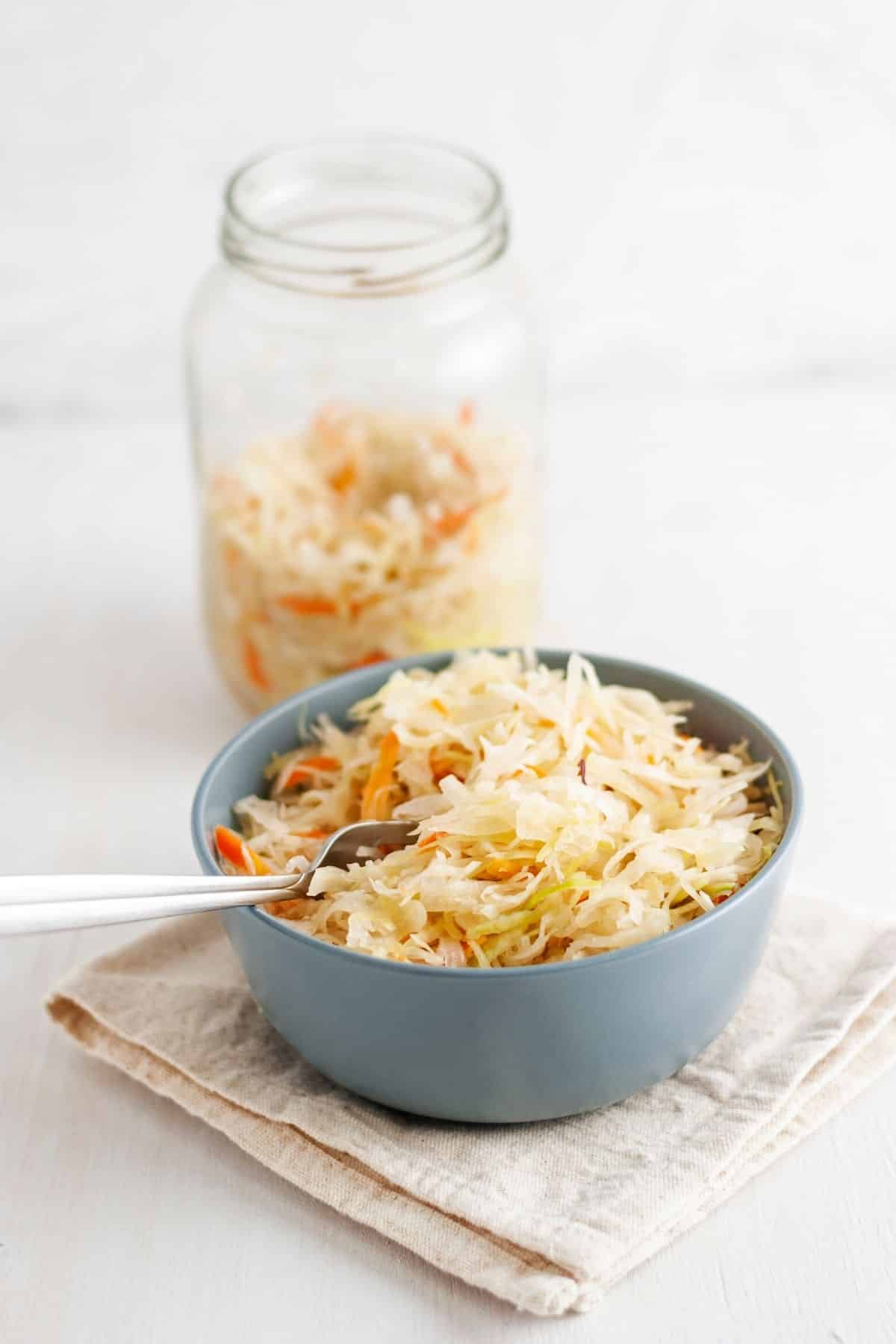 jar and bowl with sauerkraut