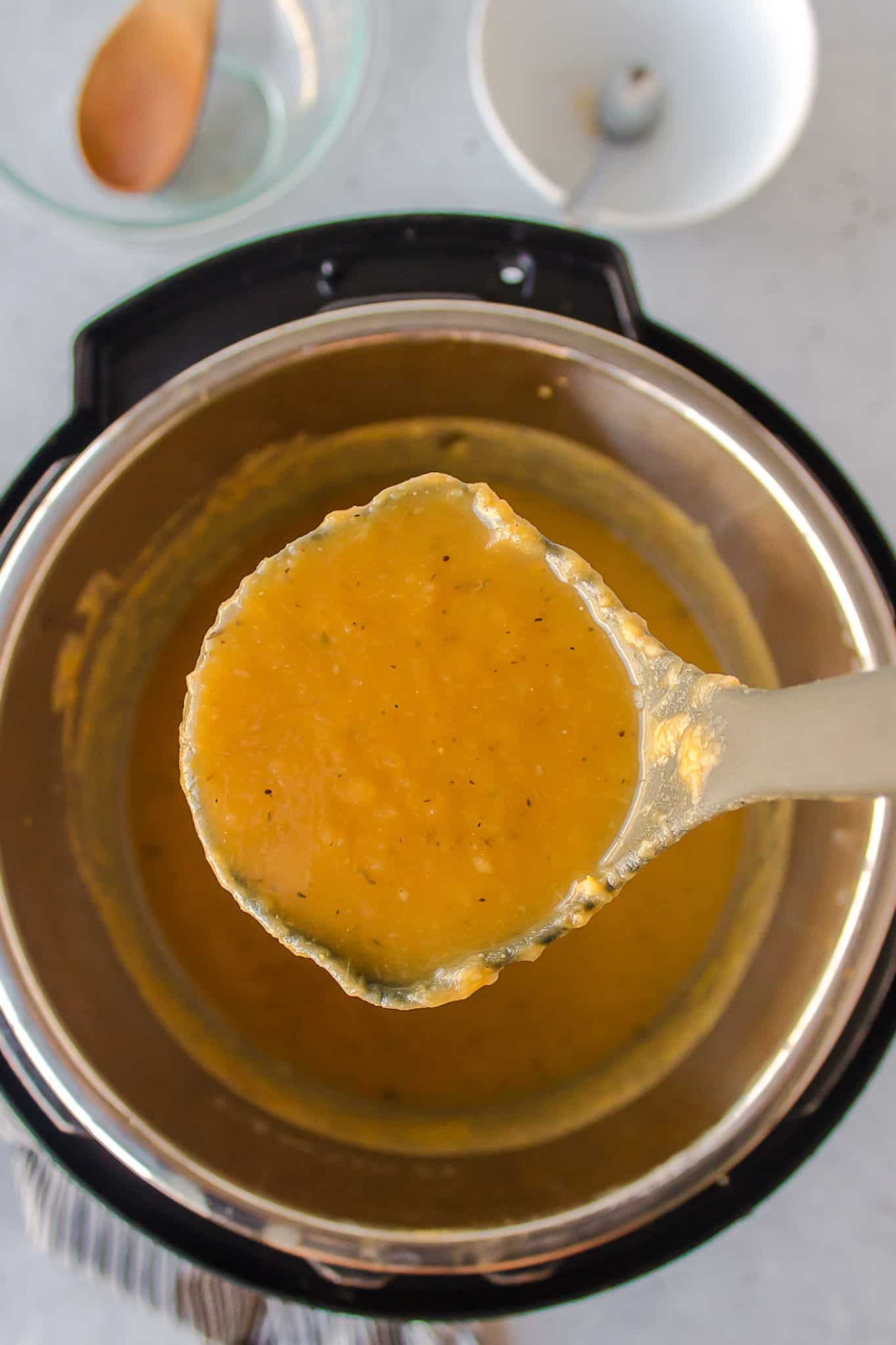 ladle of vegan potato leek soup