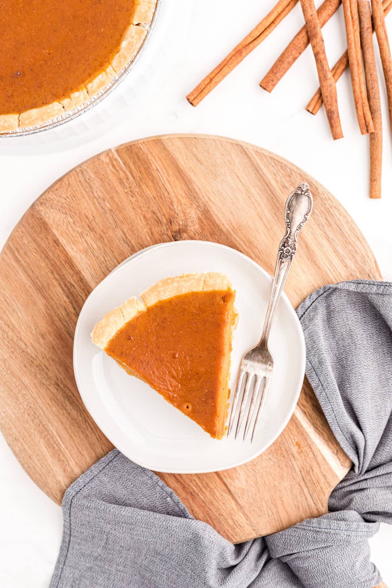 overhead photo of pumpkin pie slice on table