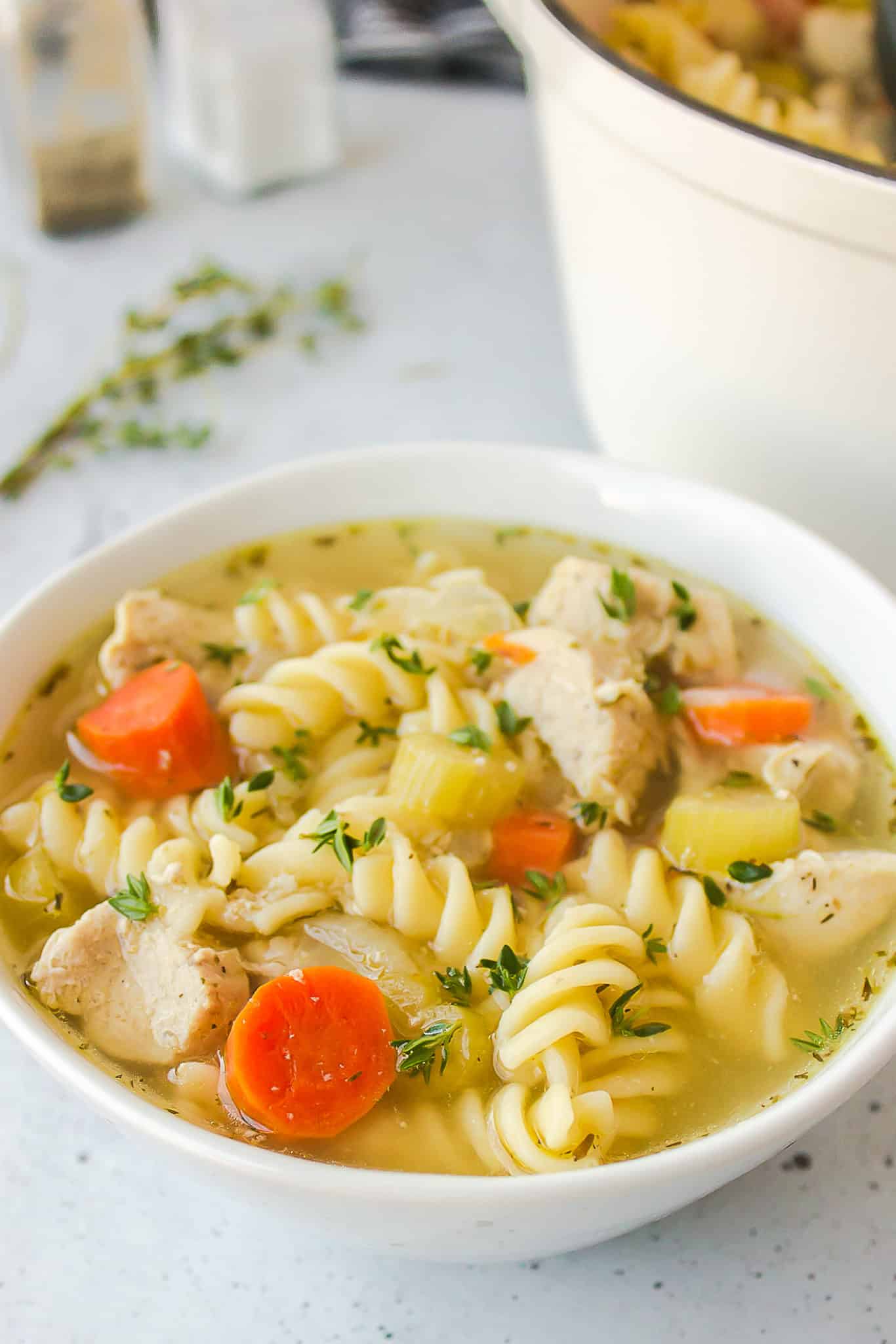 a bowl of panera chicken noodle soup made at home.