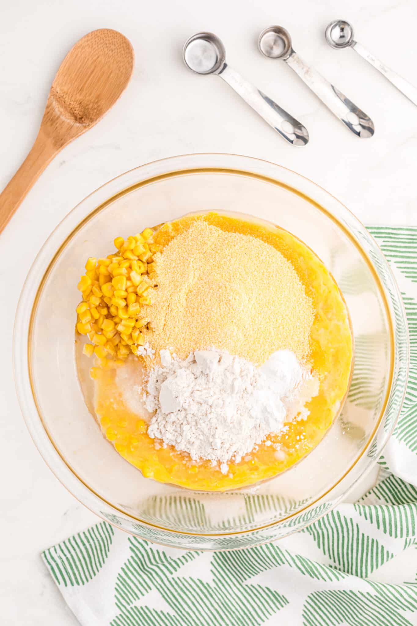 corn casserole ingredients in bowl.