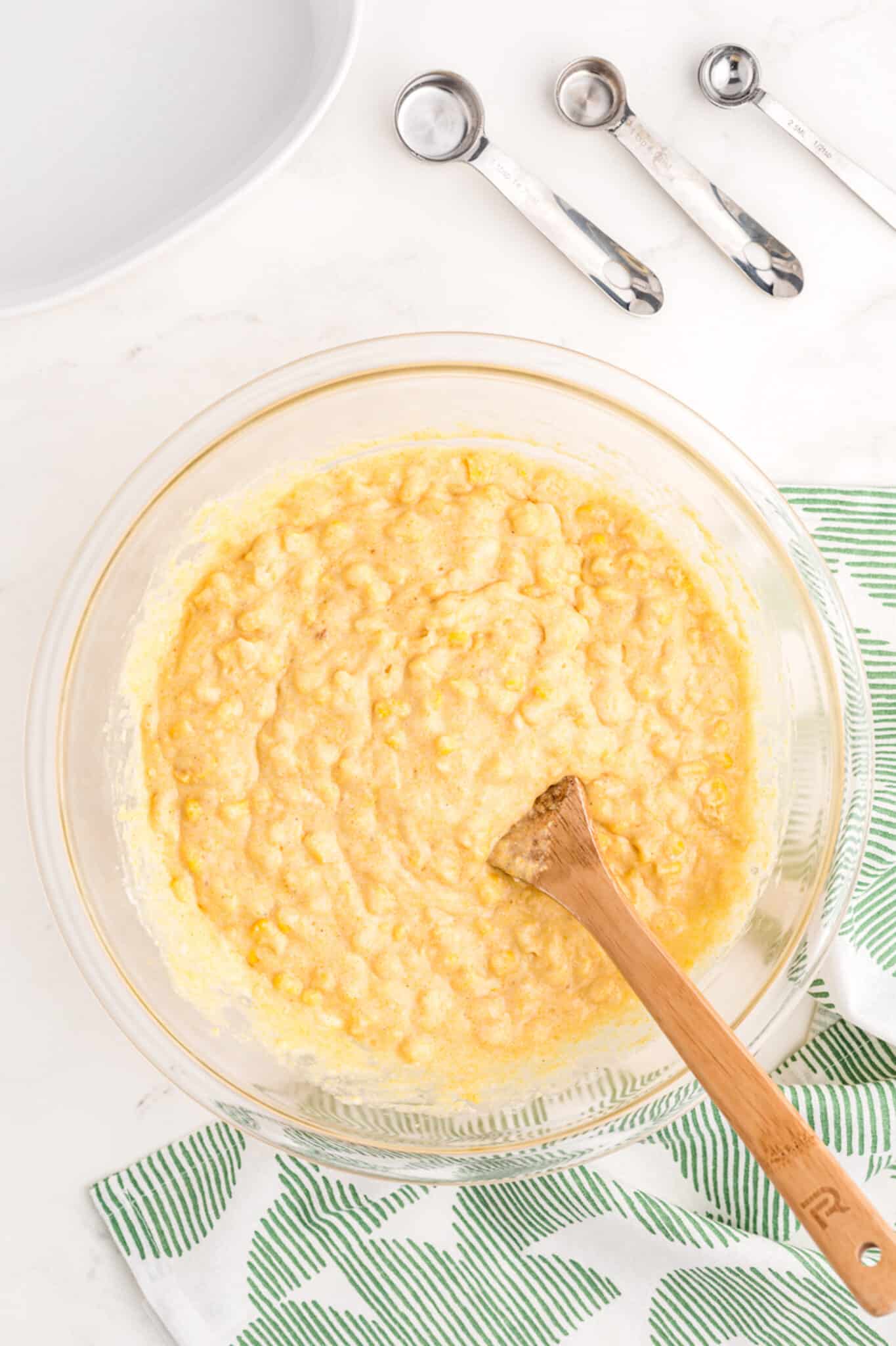 mixed up corn casserole ingredients in bowl.