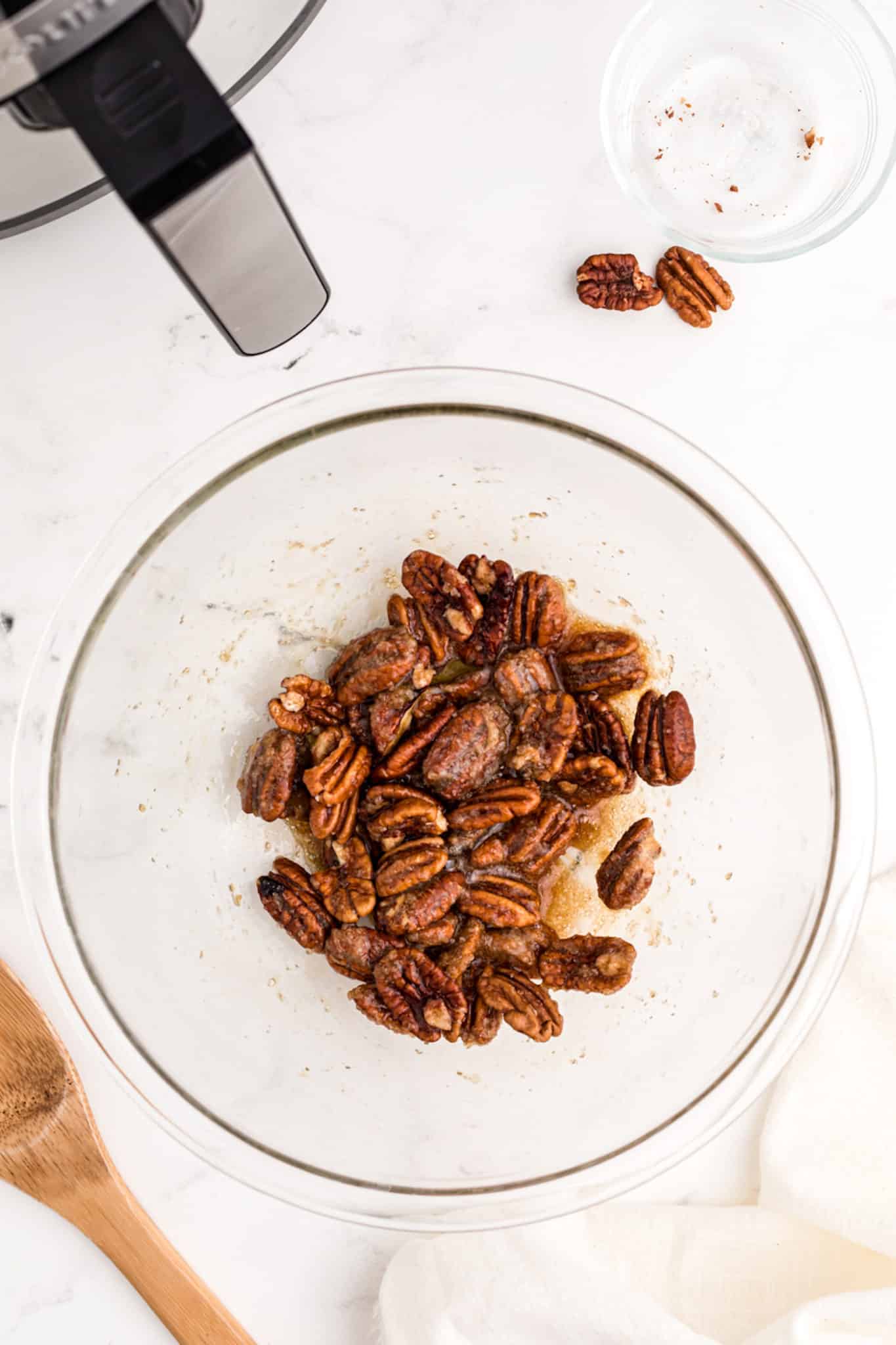 pecan and sugar mixture to make air fryer candied pecans.