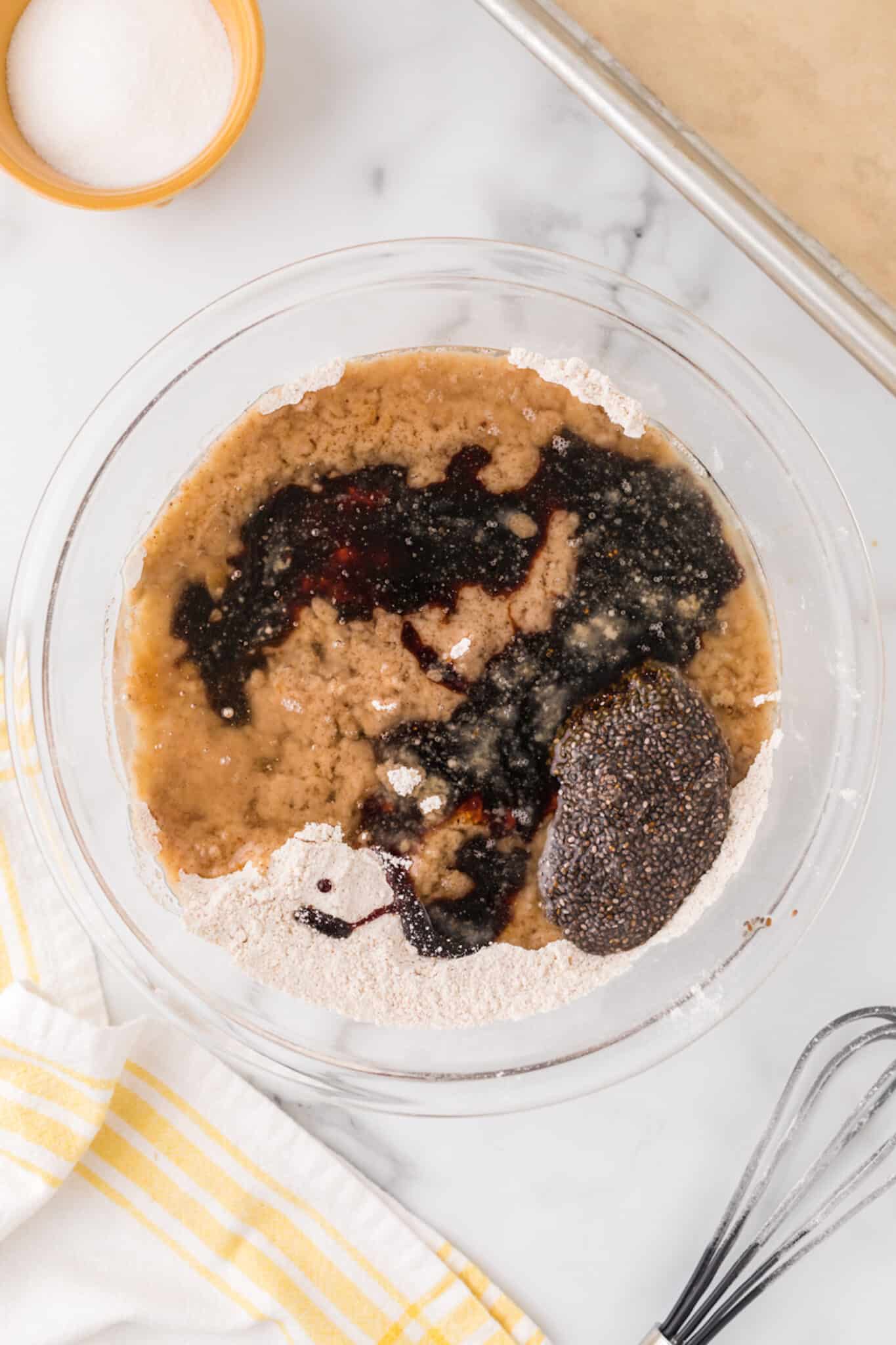ingredients in bowl for vegan ginger cookies.