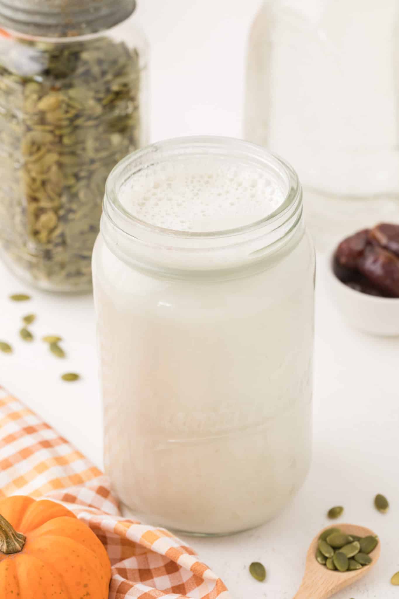 homemade pumpkin seed milk in a jar.