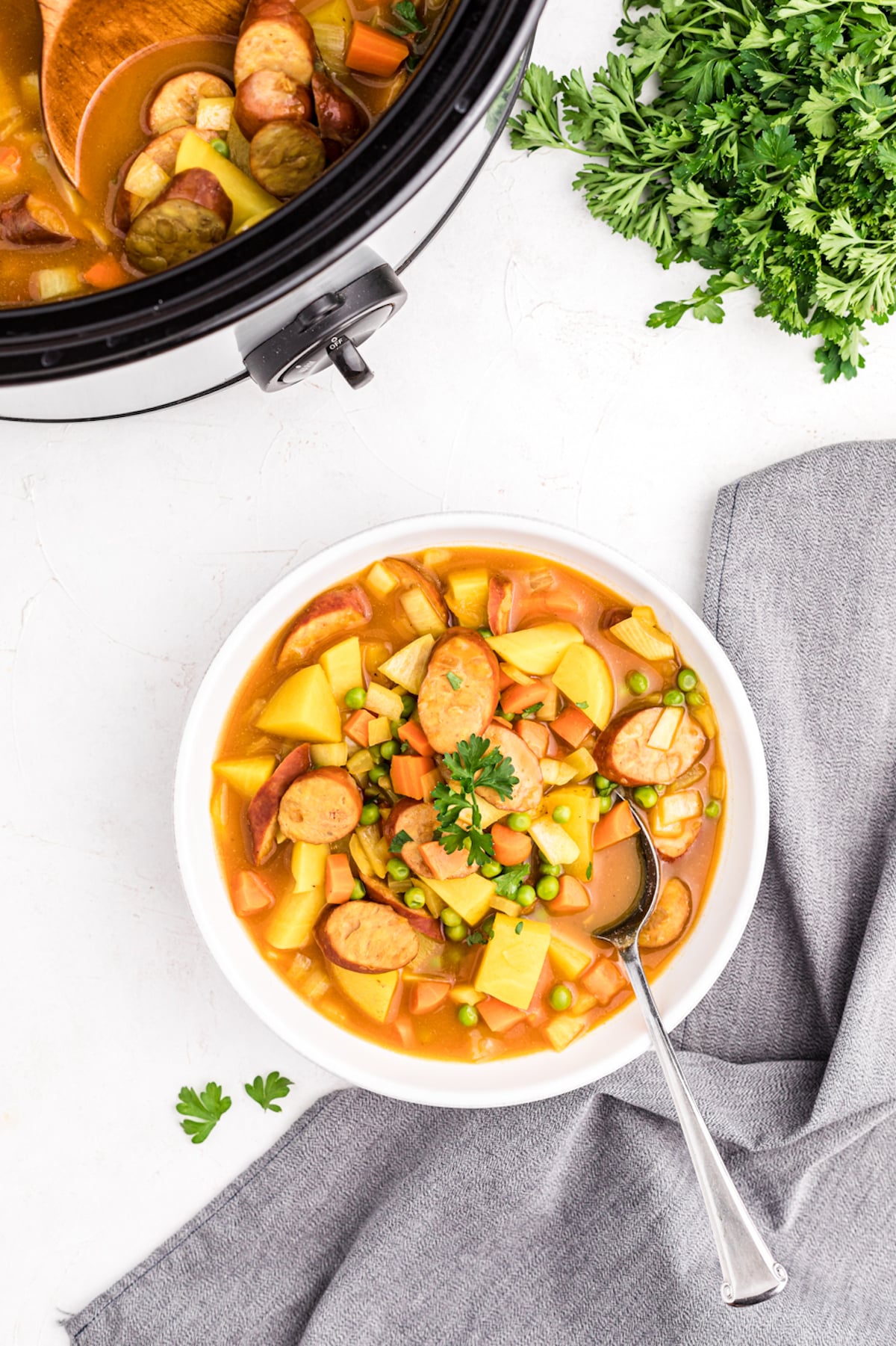 sausage curry served in white bowl