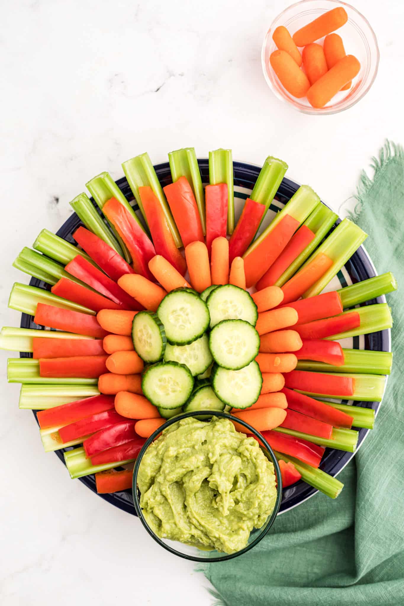 vegetable tray in shape of a turkey with guacamole.