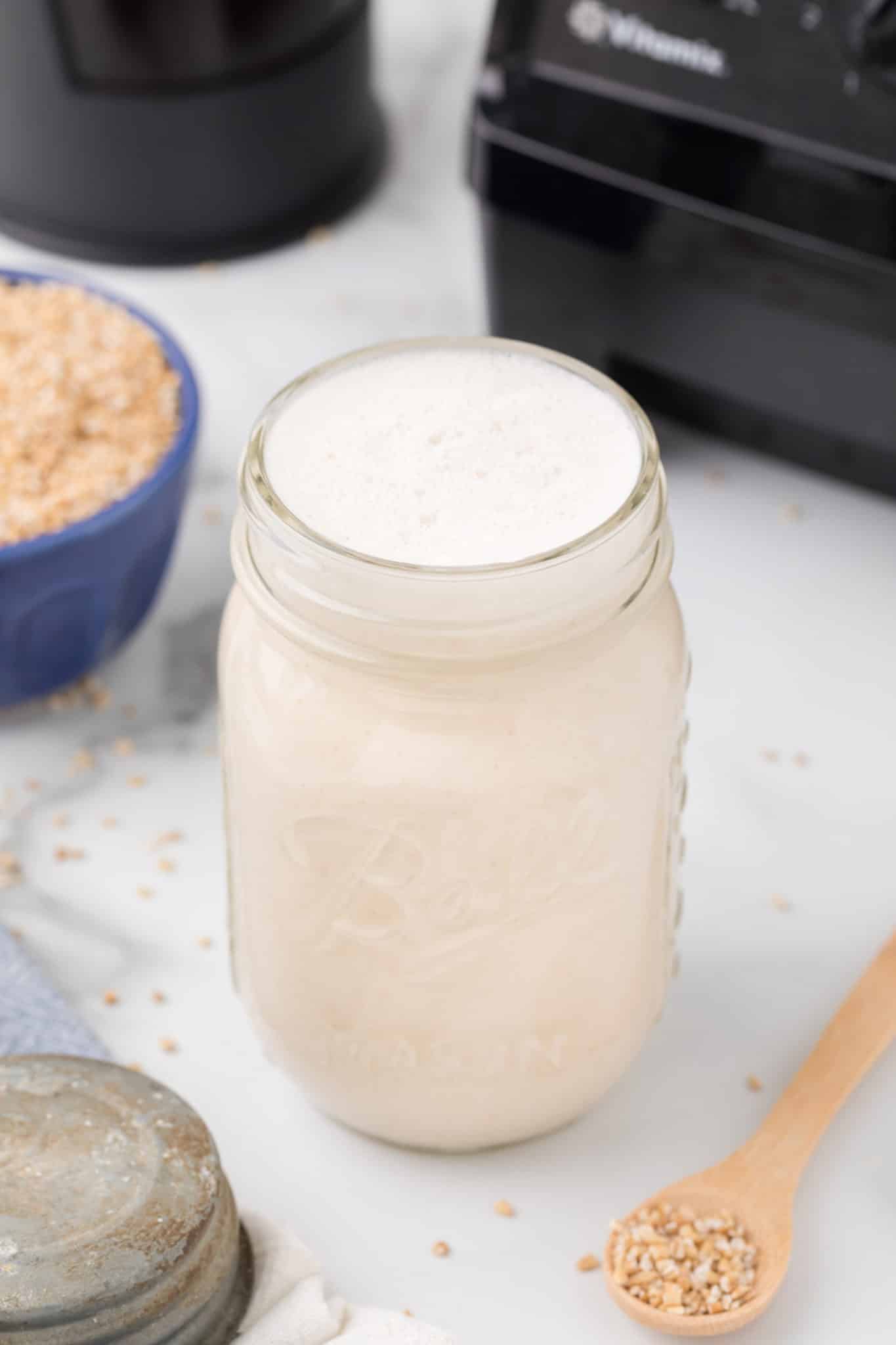 oat milk creamer in a jar on a tabletop.