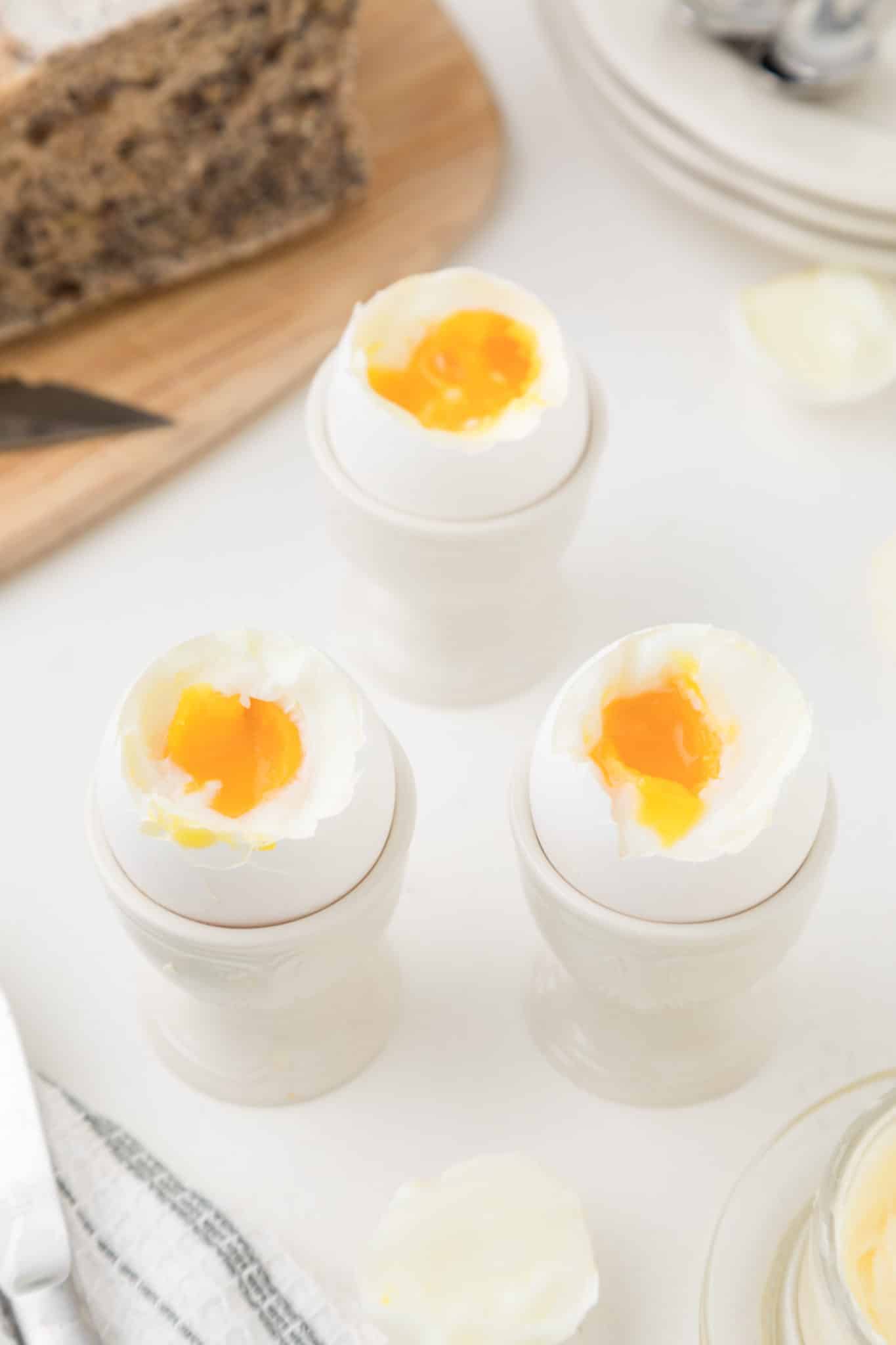 three cooked eggs served on table