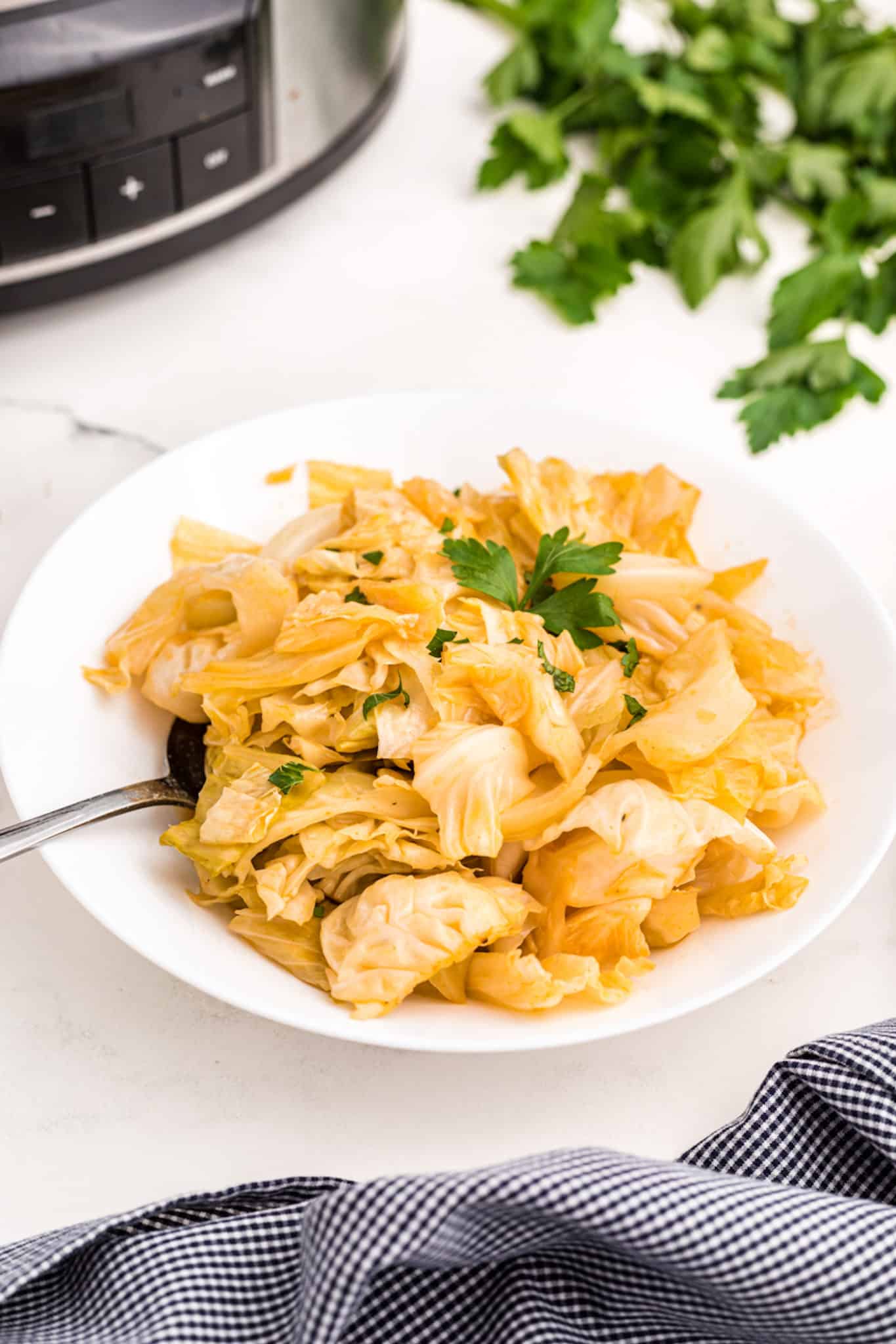 a plate of slow cooker cooked cabbage.