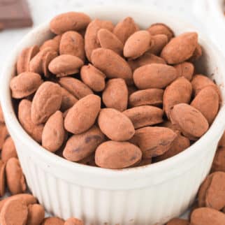 a bowl of chocolate covered almonds