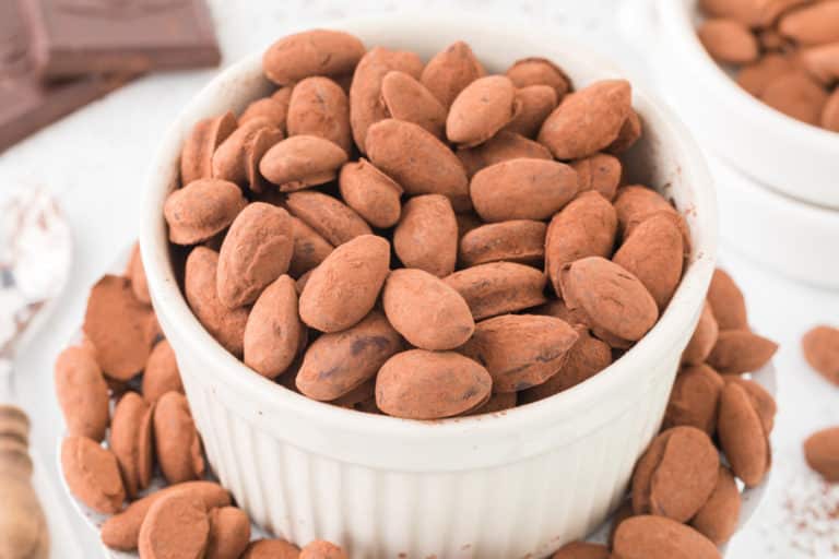 a bowl of chocolate covered almonds