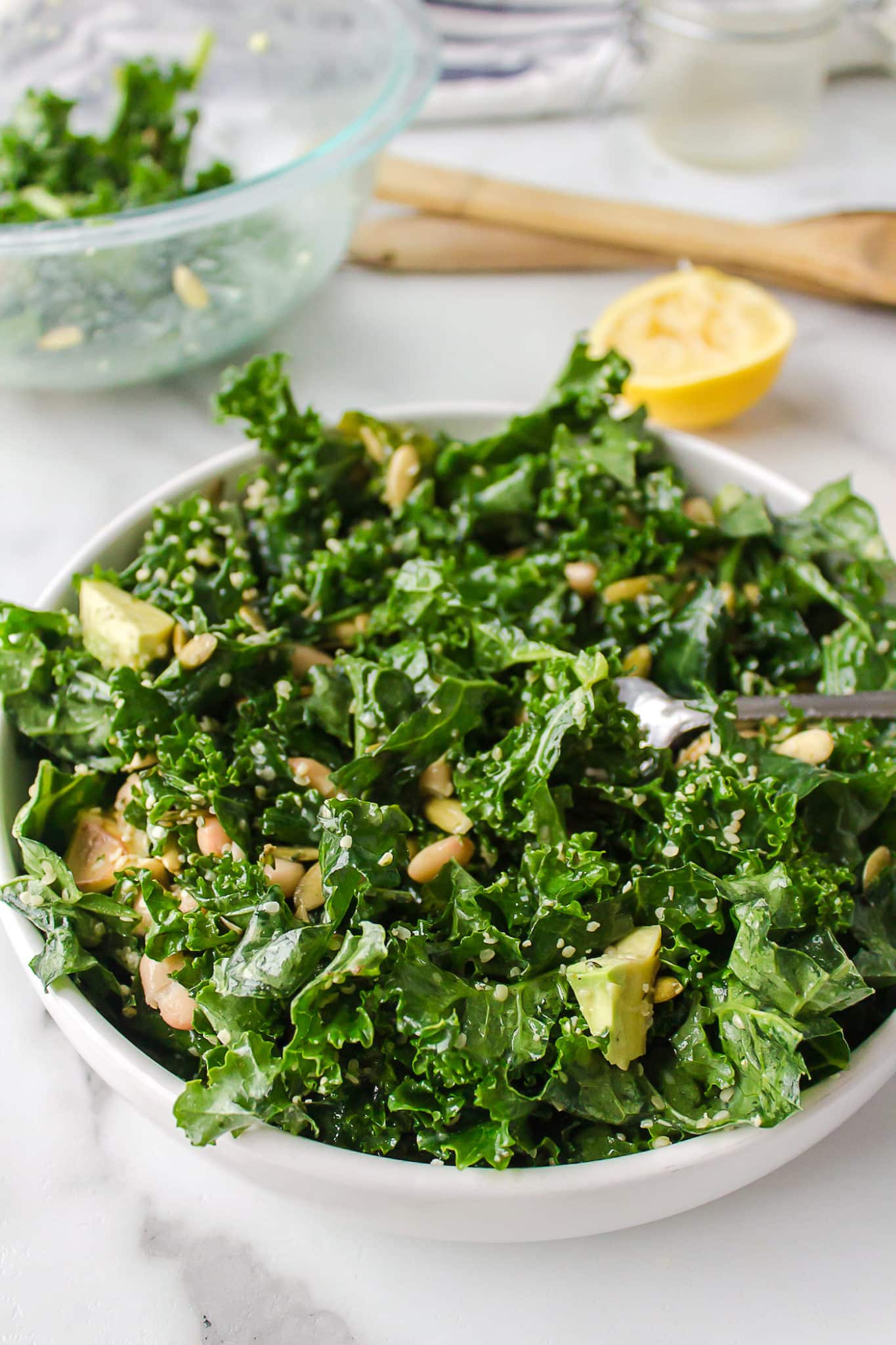 a bowl of erewhon white bean kale salad.