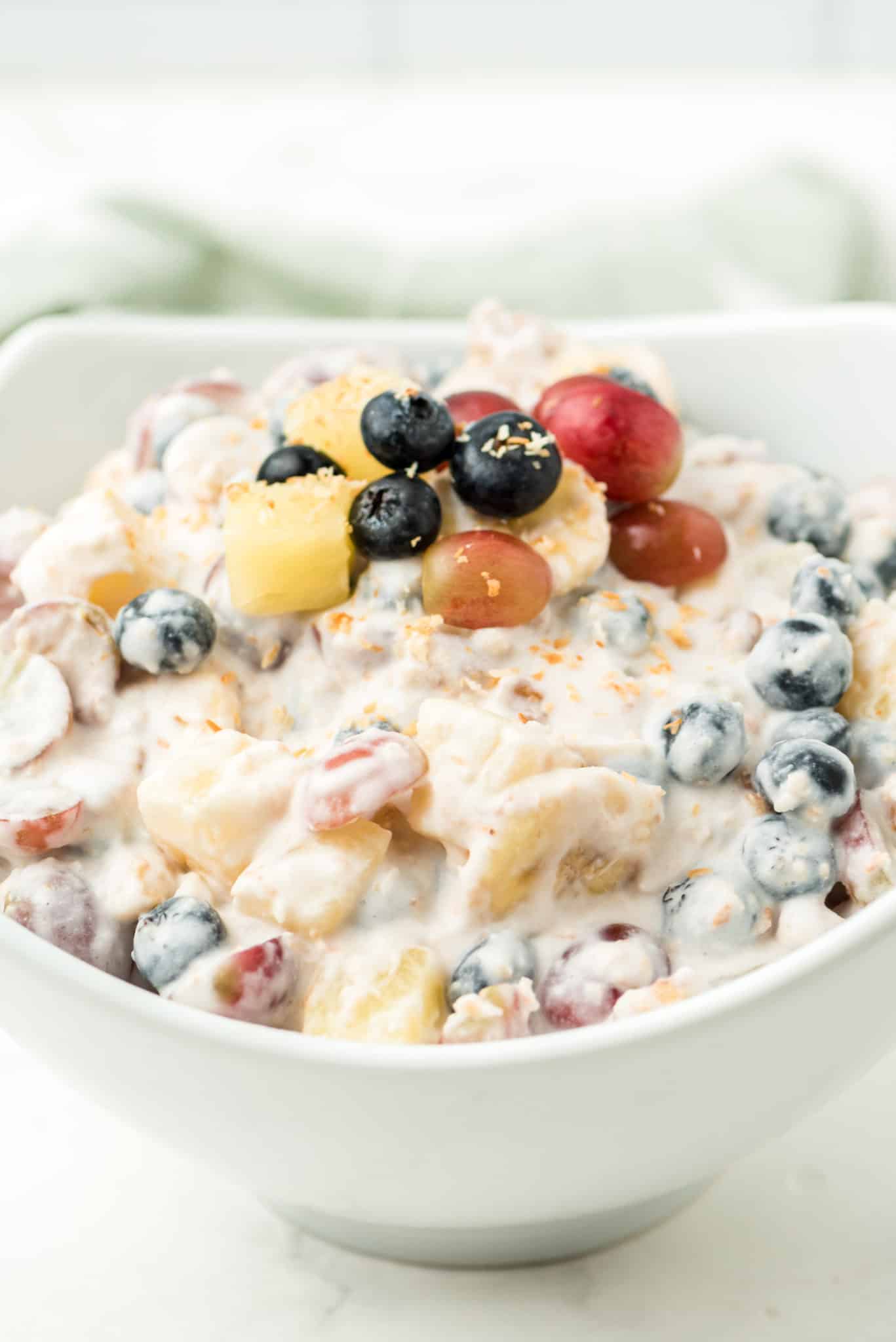 bowl of healthy ambrosia salad with coconut