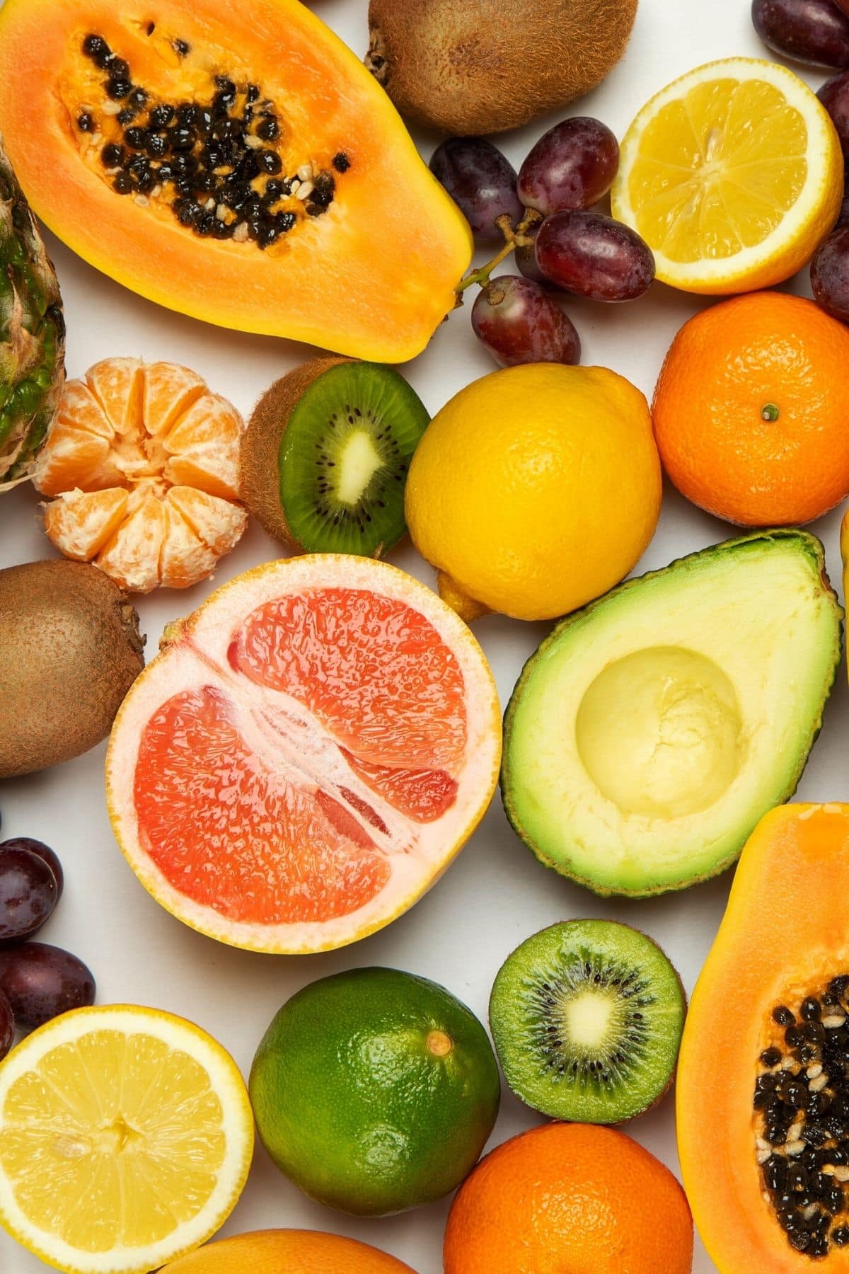 Fresh fruits on a white surface.