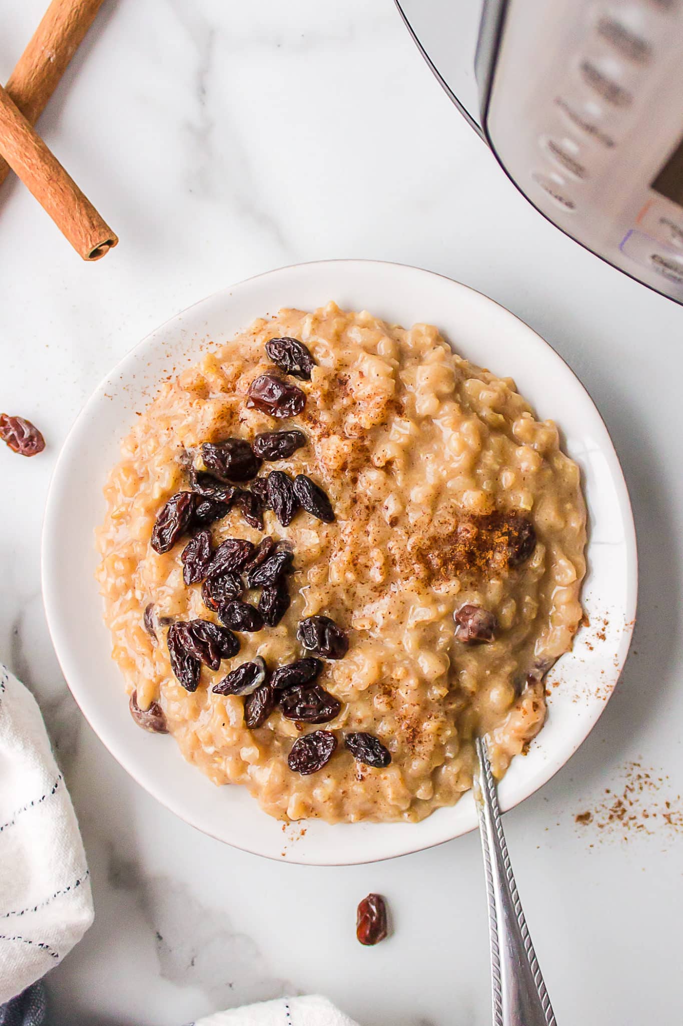 instant pot brown rice pudding in a white bowl.