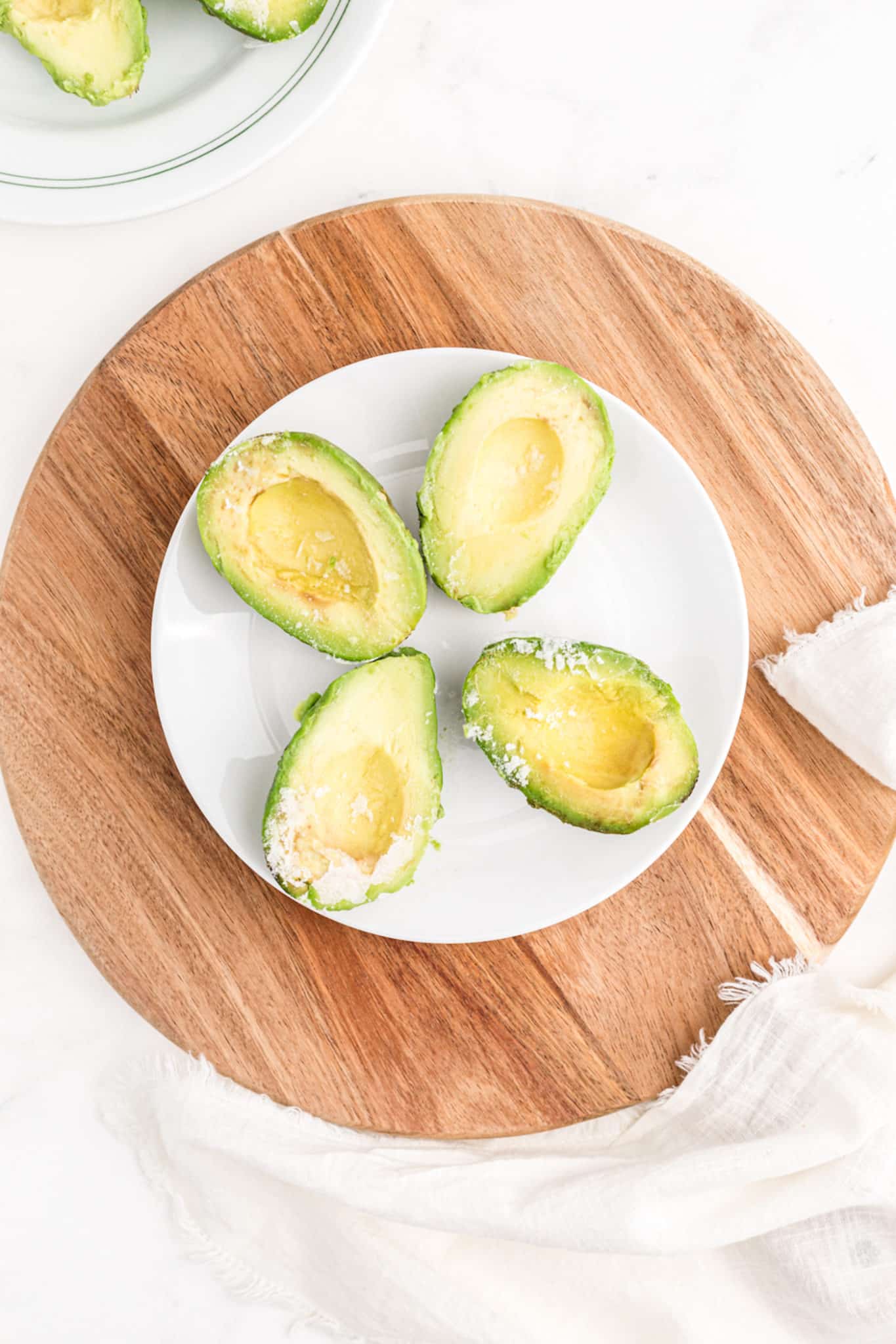 plate with four frozen avocado halves