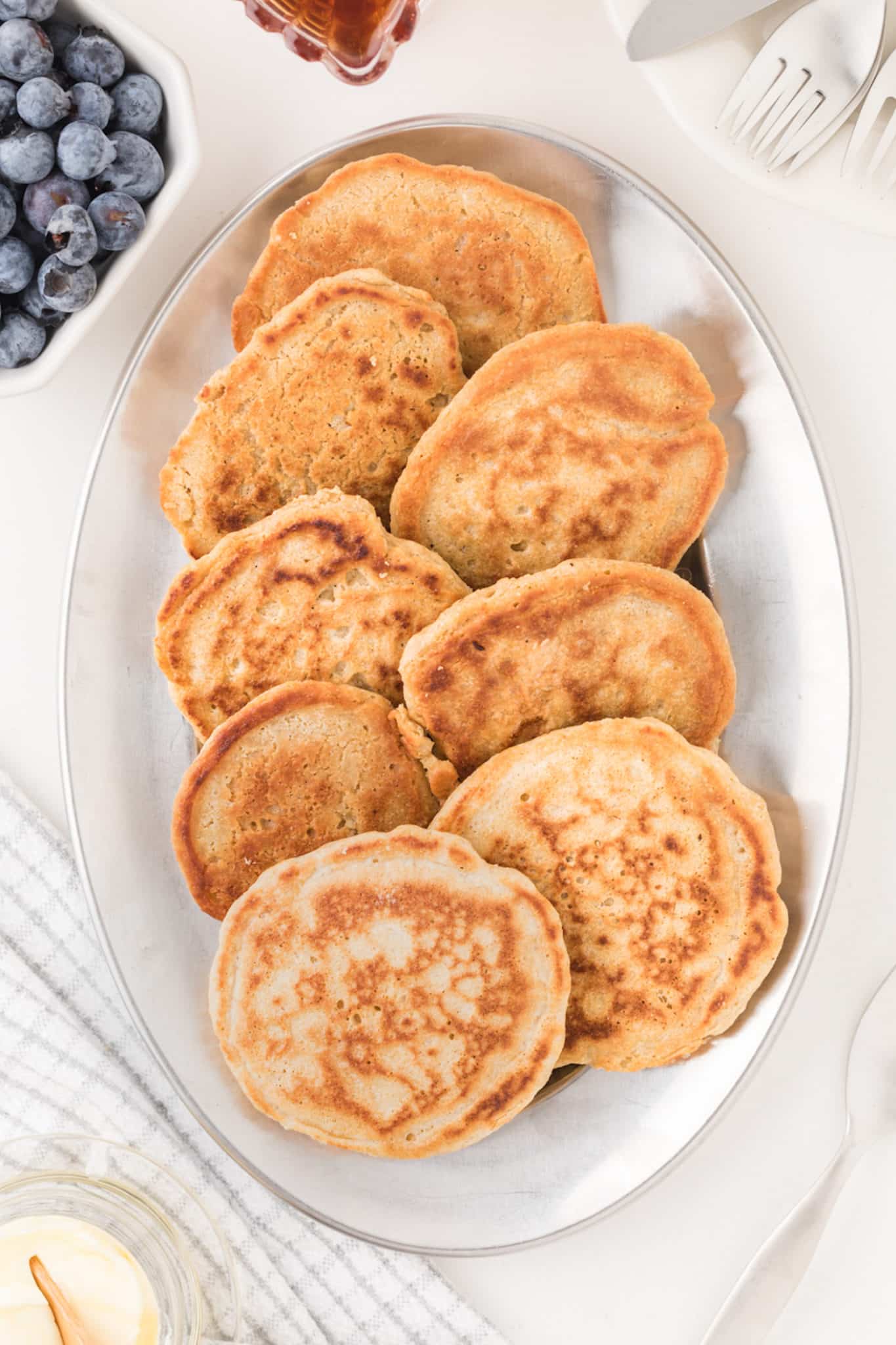 cooked oat flour pancakes on platter