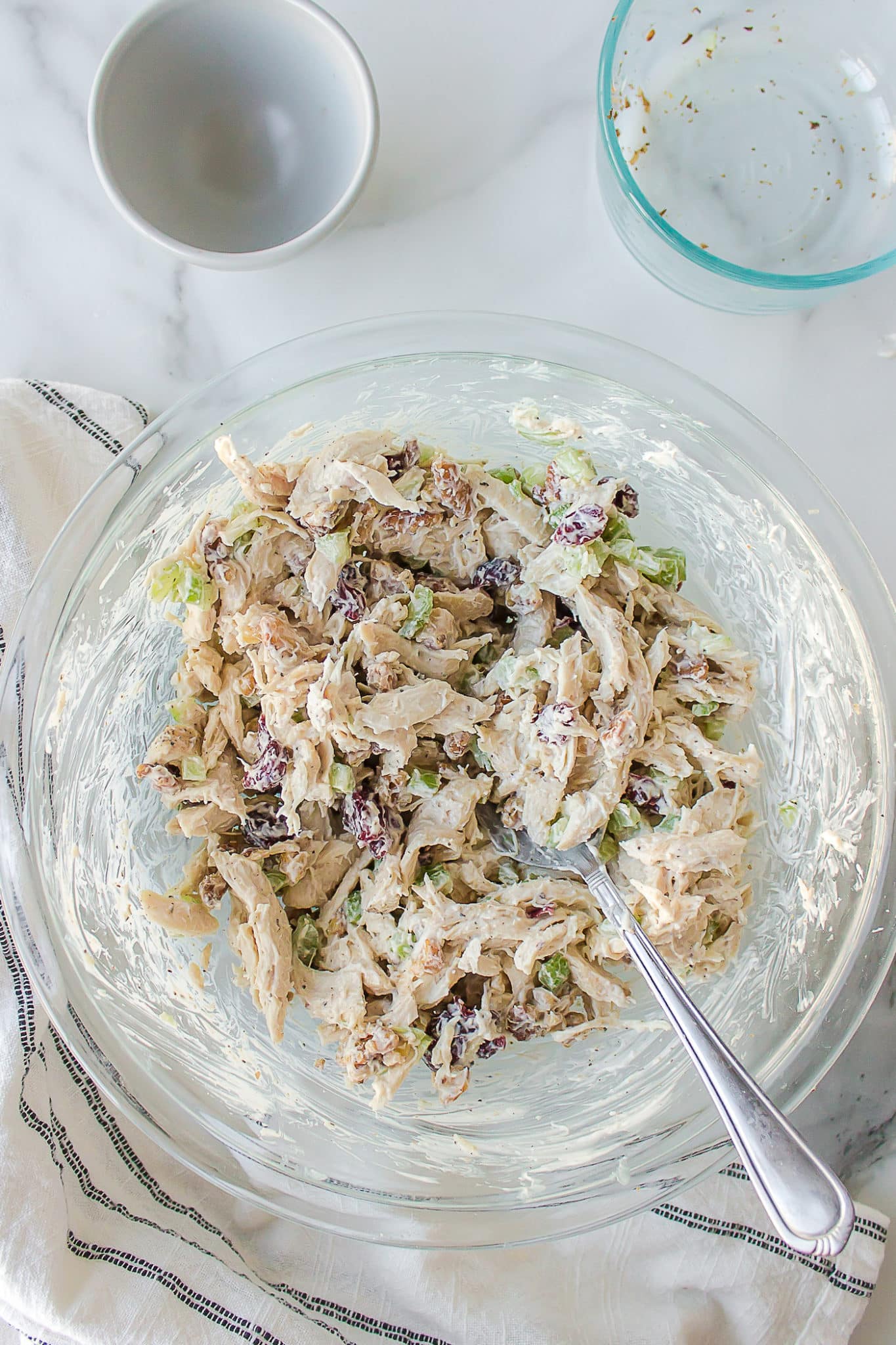 a bowl of shredded chicken salad.