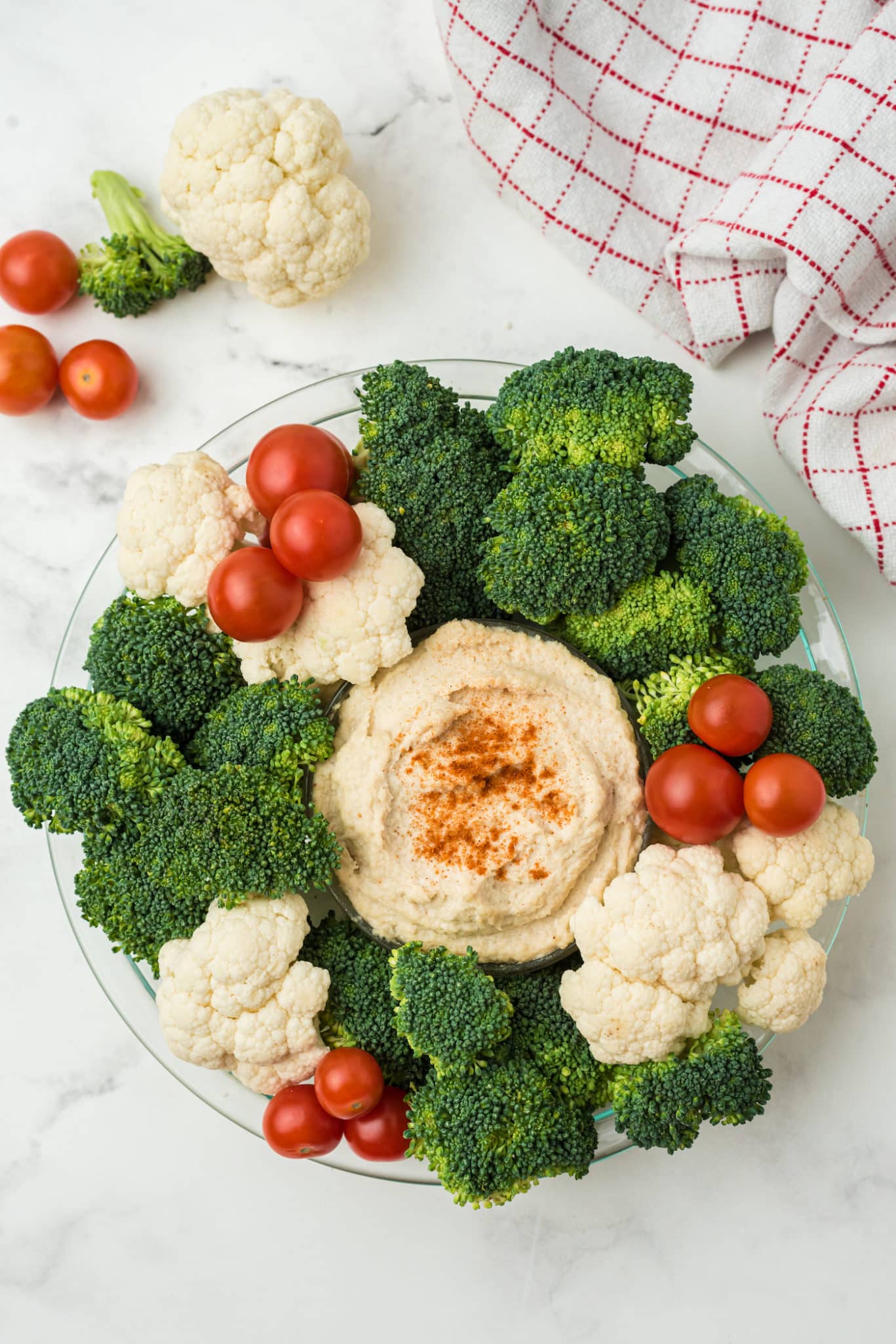 broccoli and cauliflower around hummus
