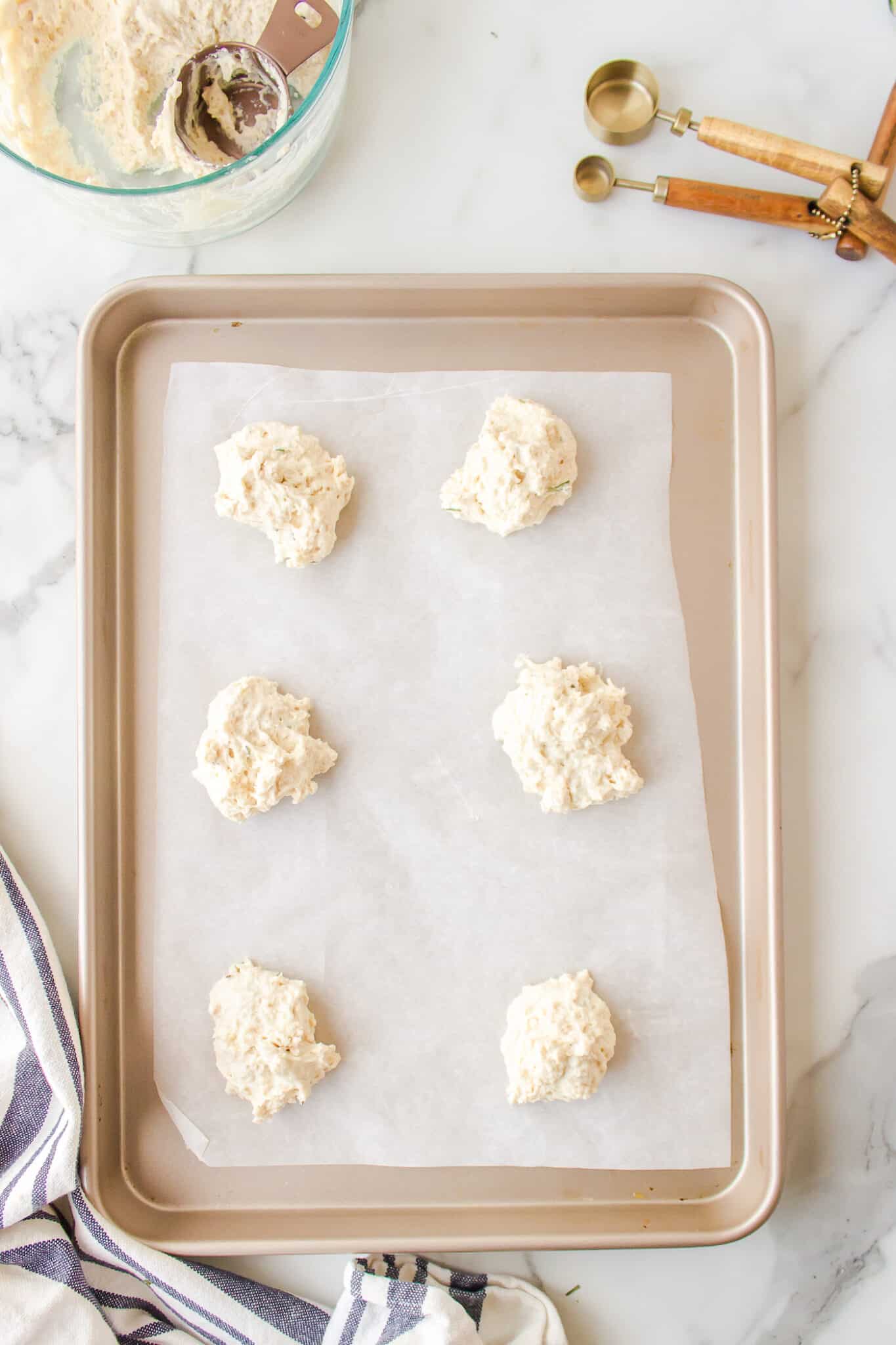 gluten-free drop biscuits on baking sheet ready for the oven.