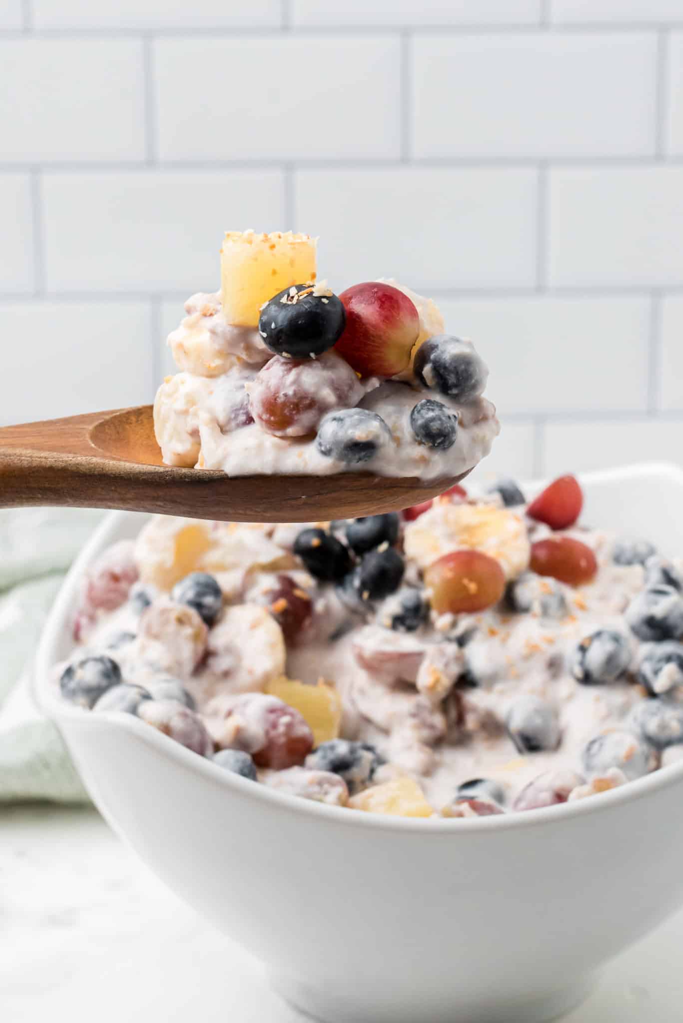 a spoonful of fruit and coconut cream