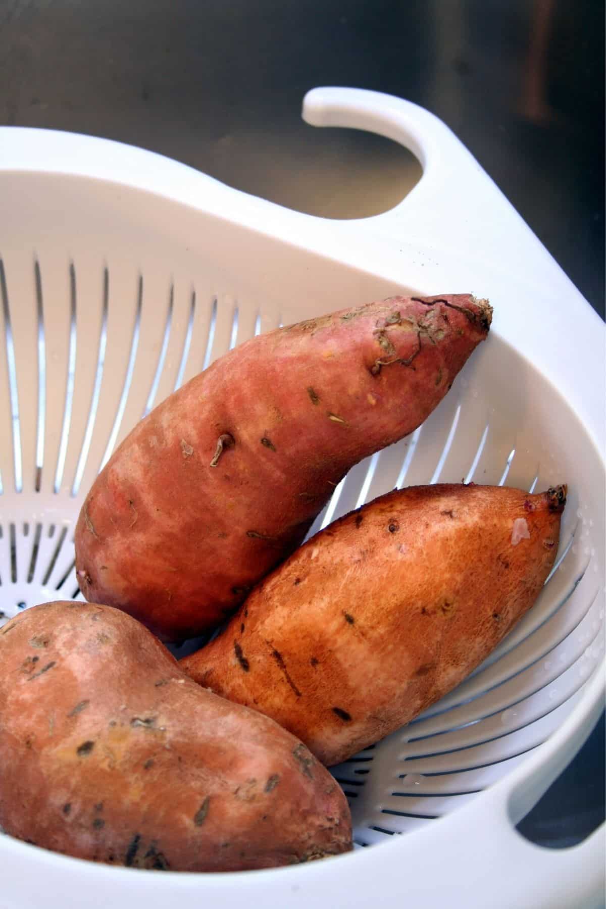 sweet potatoes in a colander.