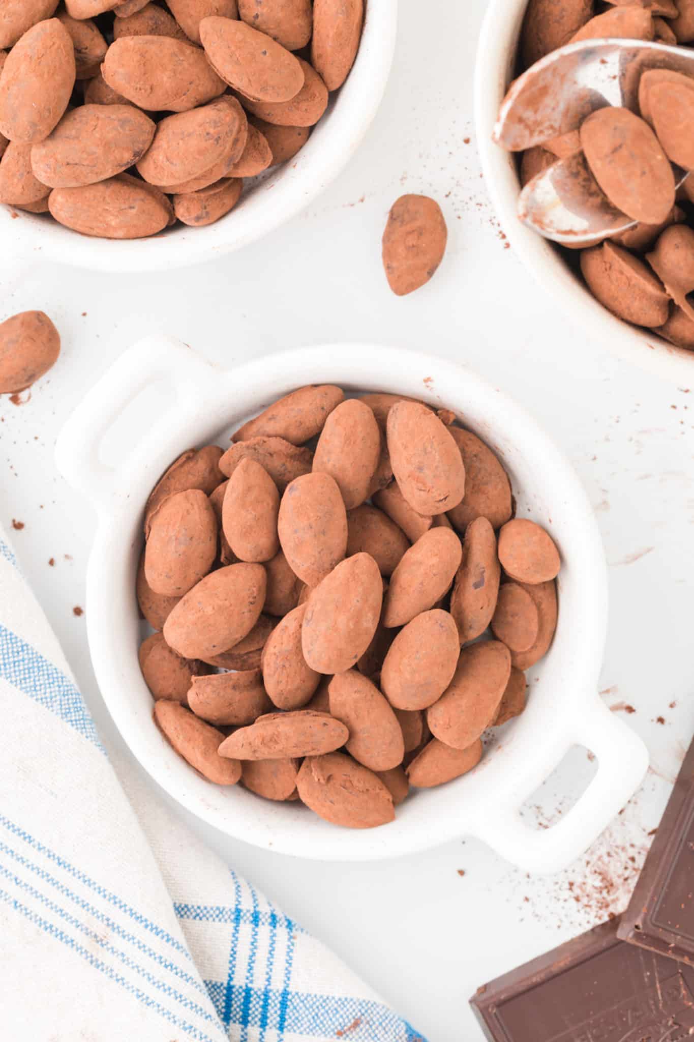 two bowls chocolate almonds