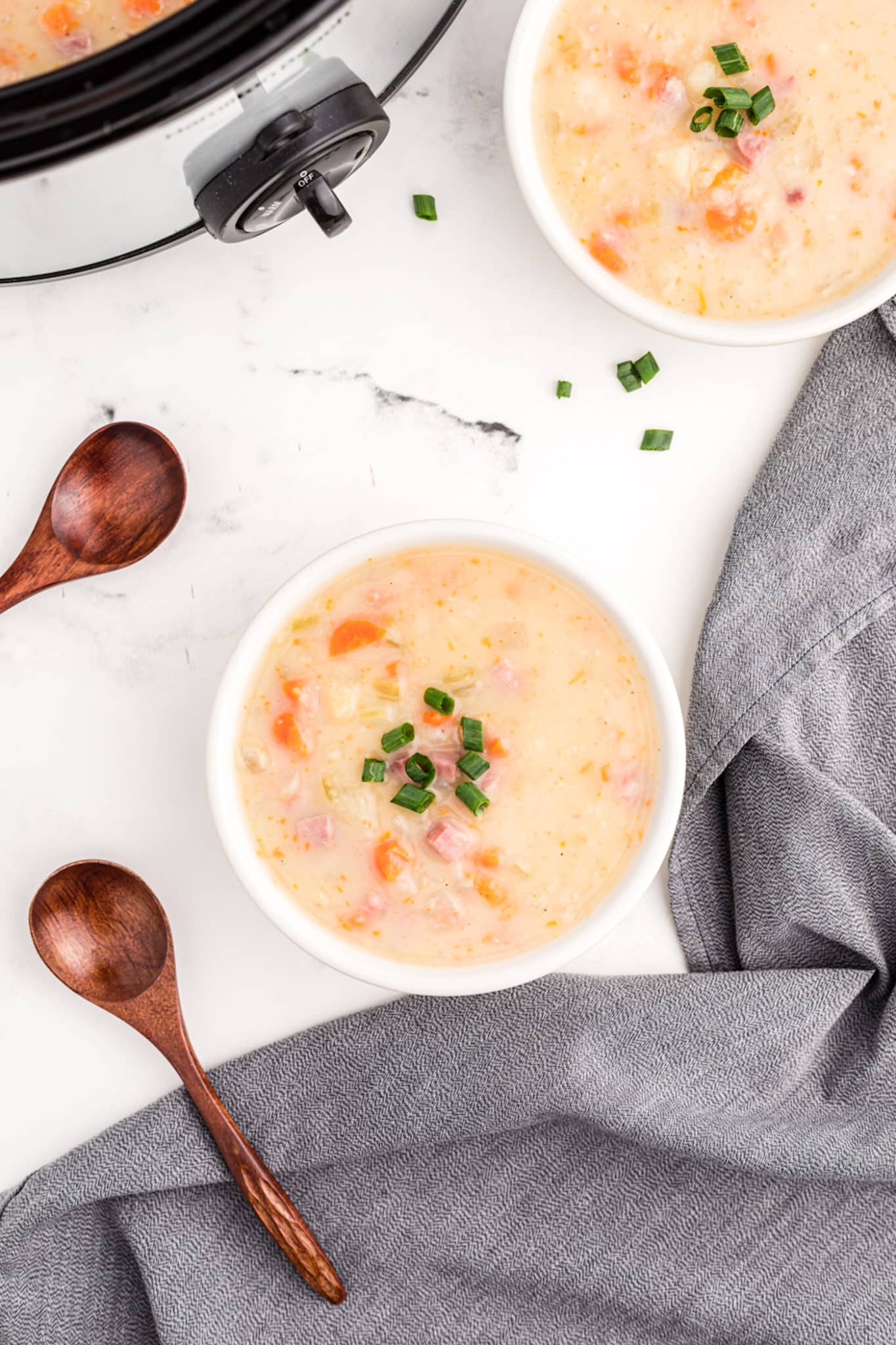a bowl of slower cooker potato soup with ham.