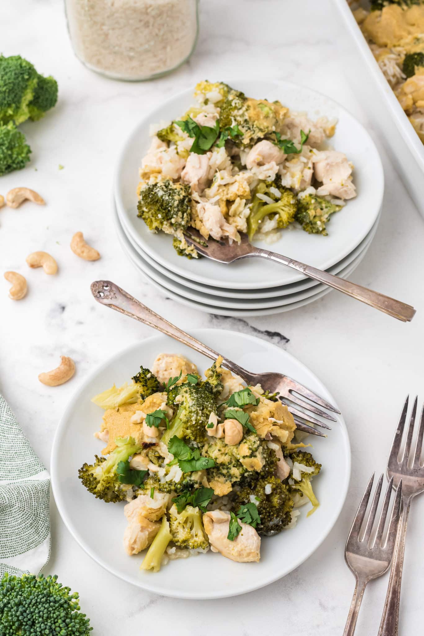 two plates of dairy-free broccoli, rice and chicken casserole.