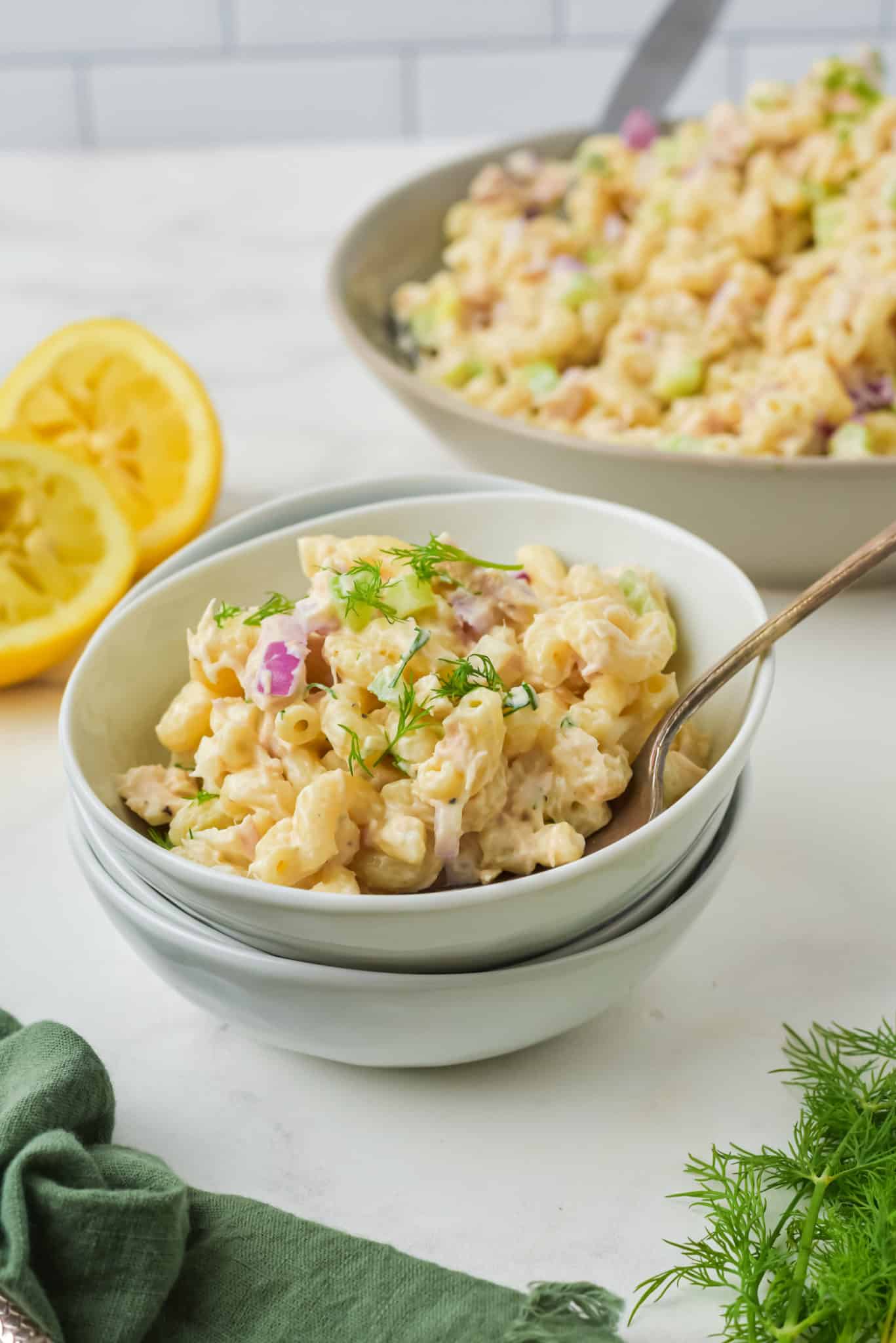 a bowl of pasta salad with tuna.