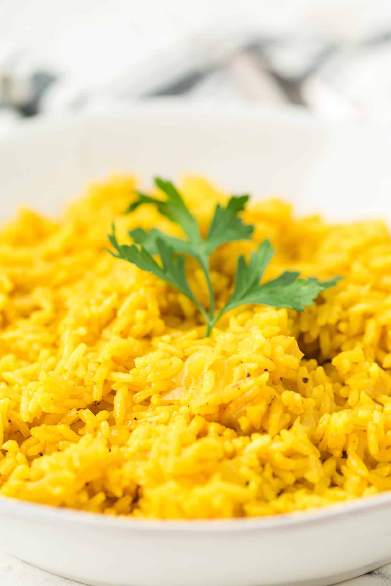 bow with cooked yellow rice.