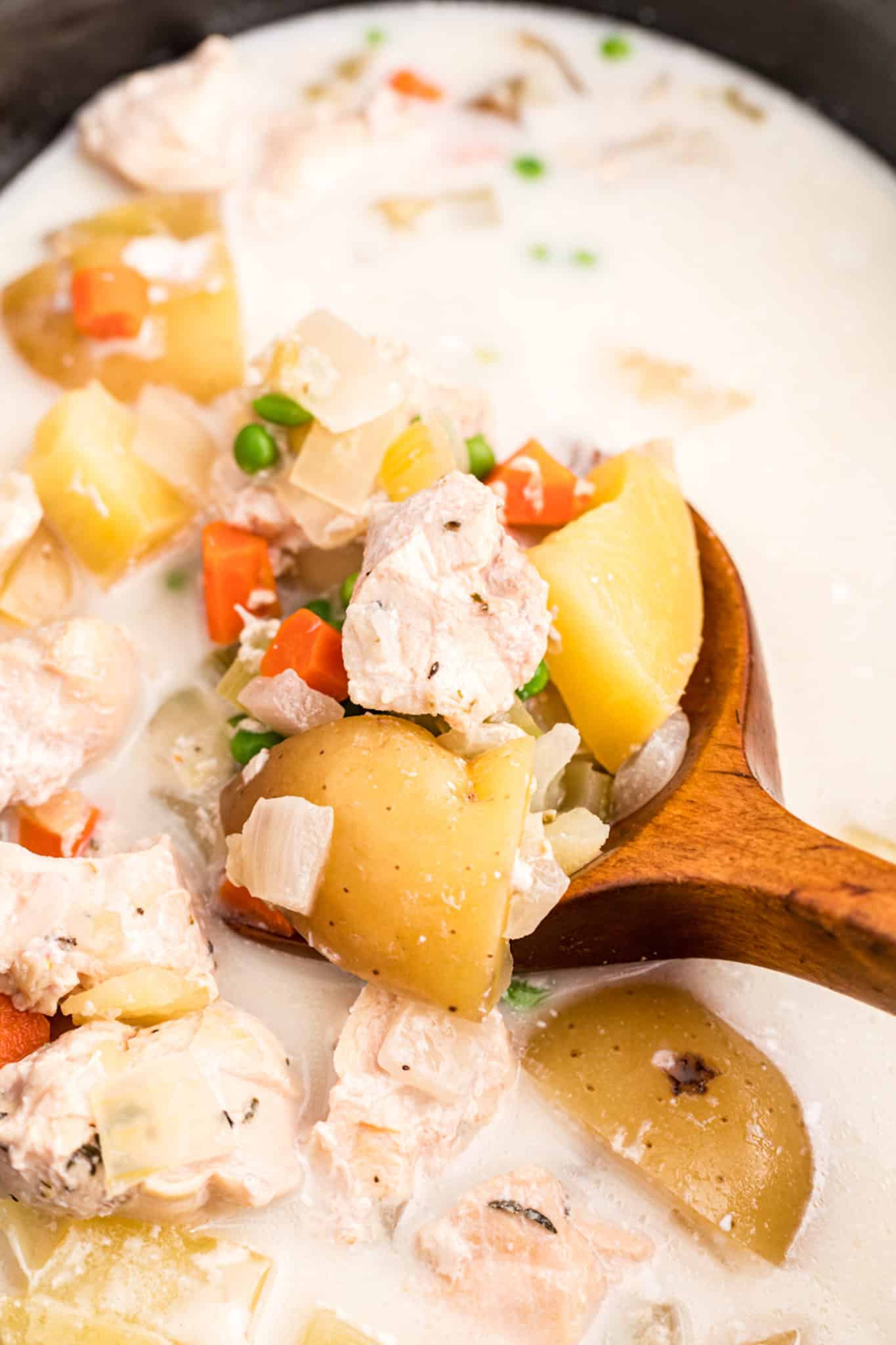 a spoonful of crockpot coconut chicken and potatoes.