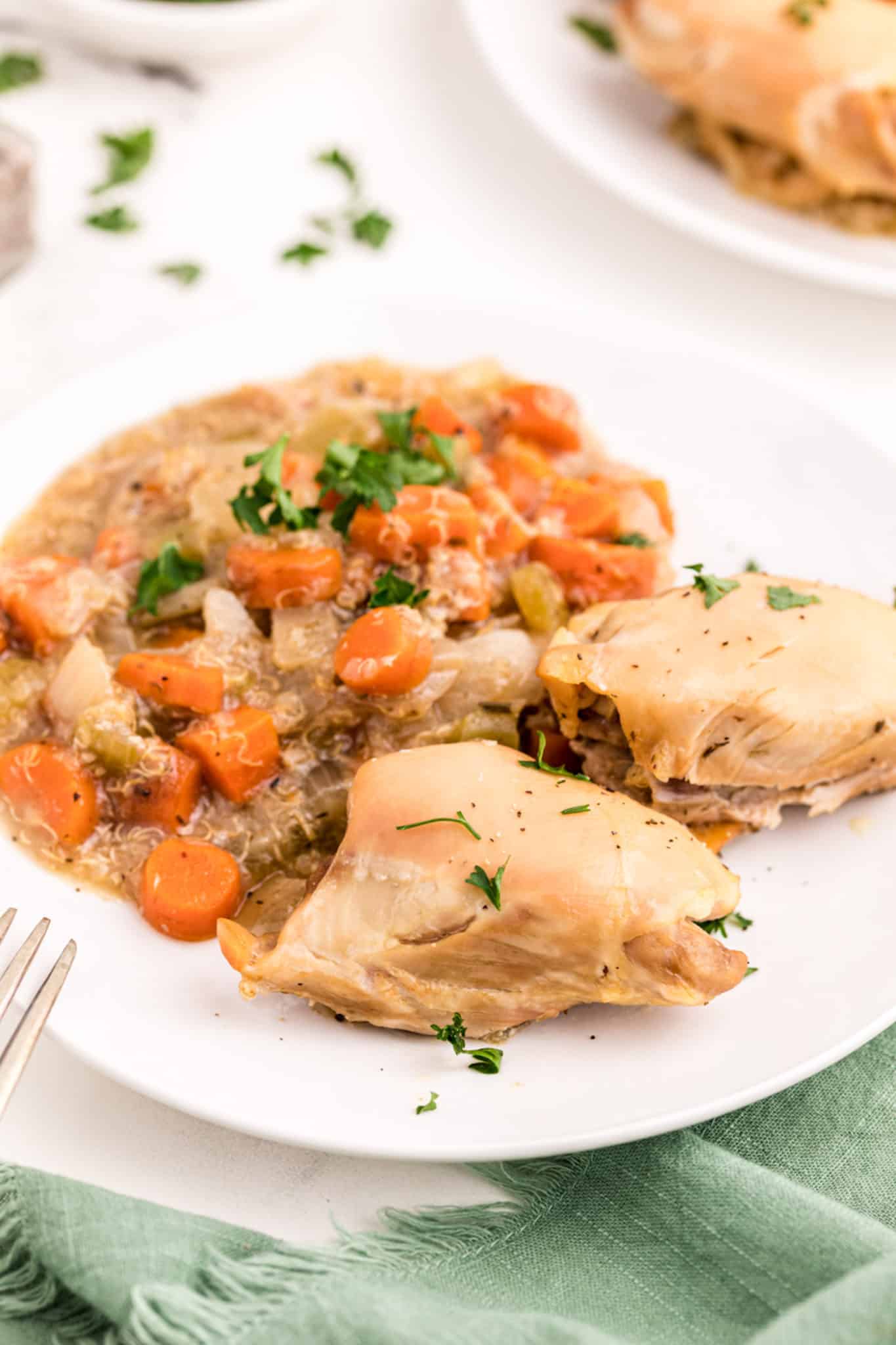 slow cooker chicken, carrots, and quinoa served on a plate.
