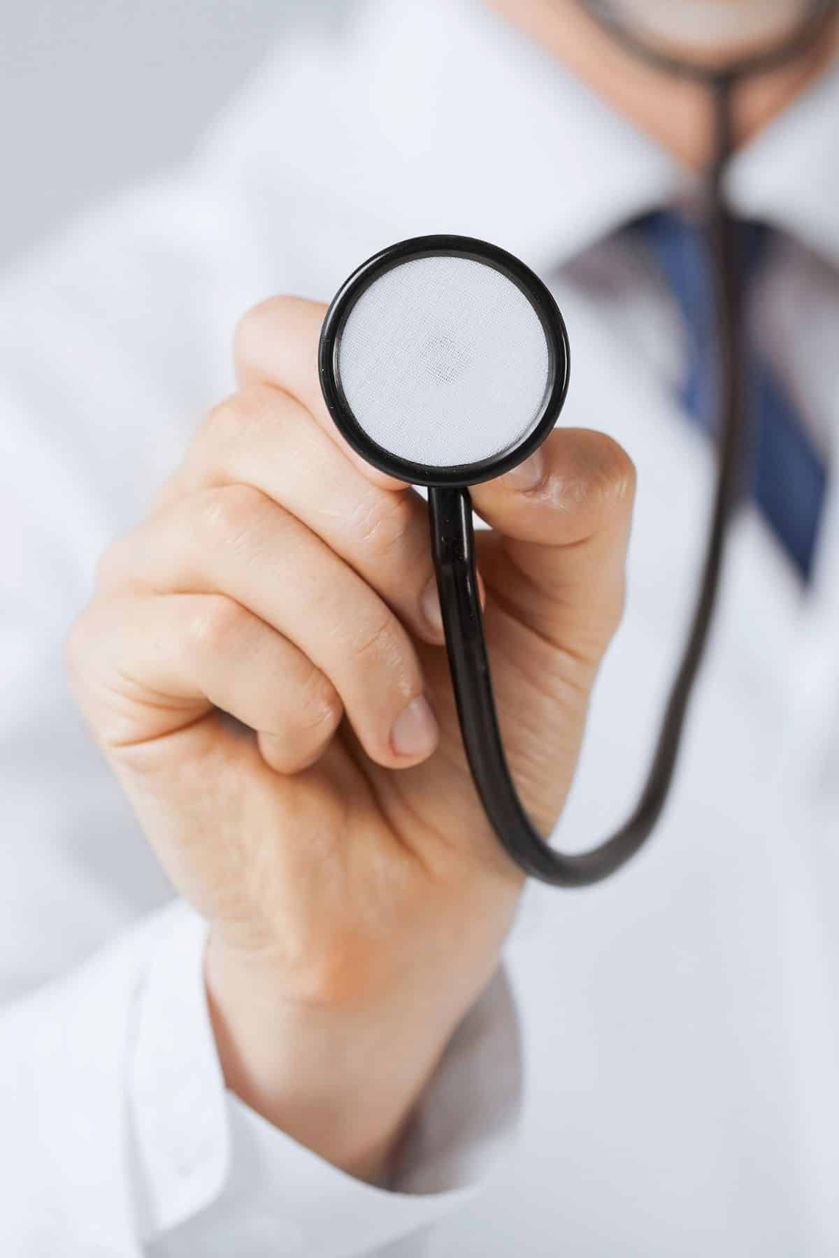 doctor holding stethoscope.