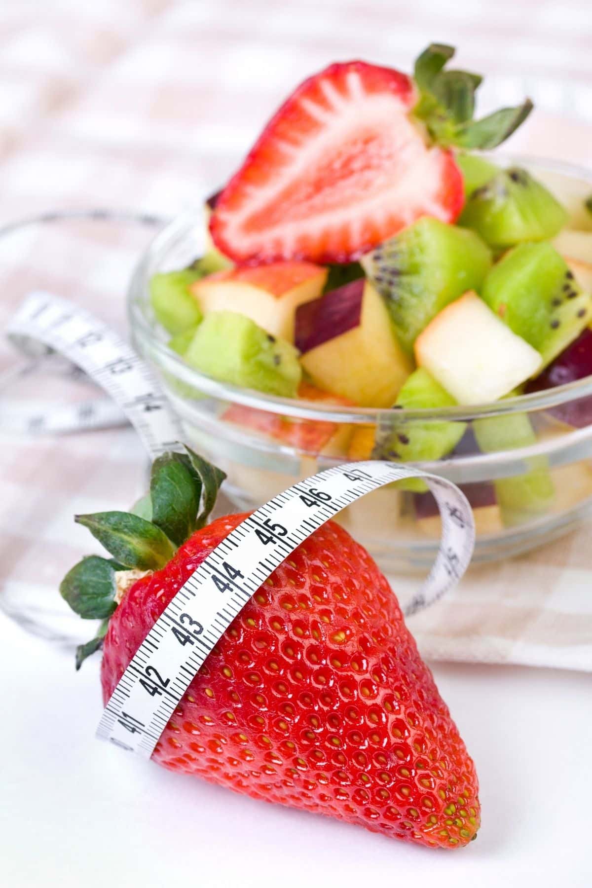 fruit salad with a measuring tape.