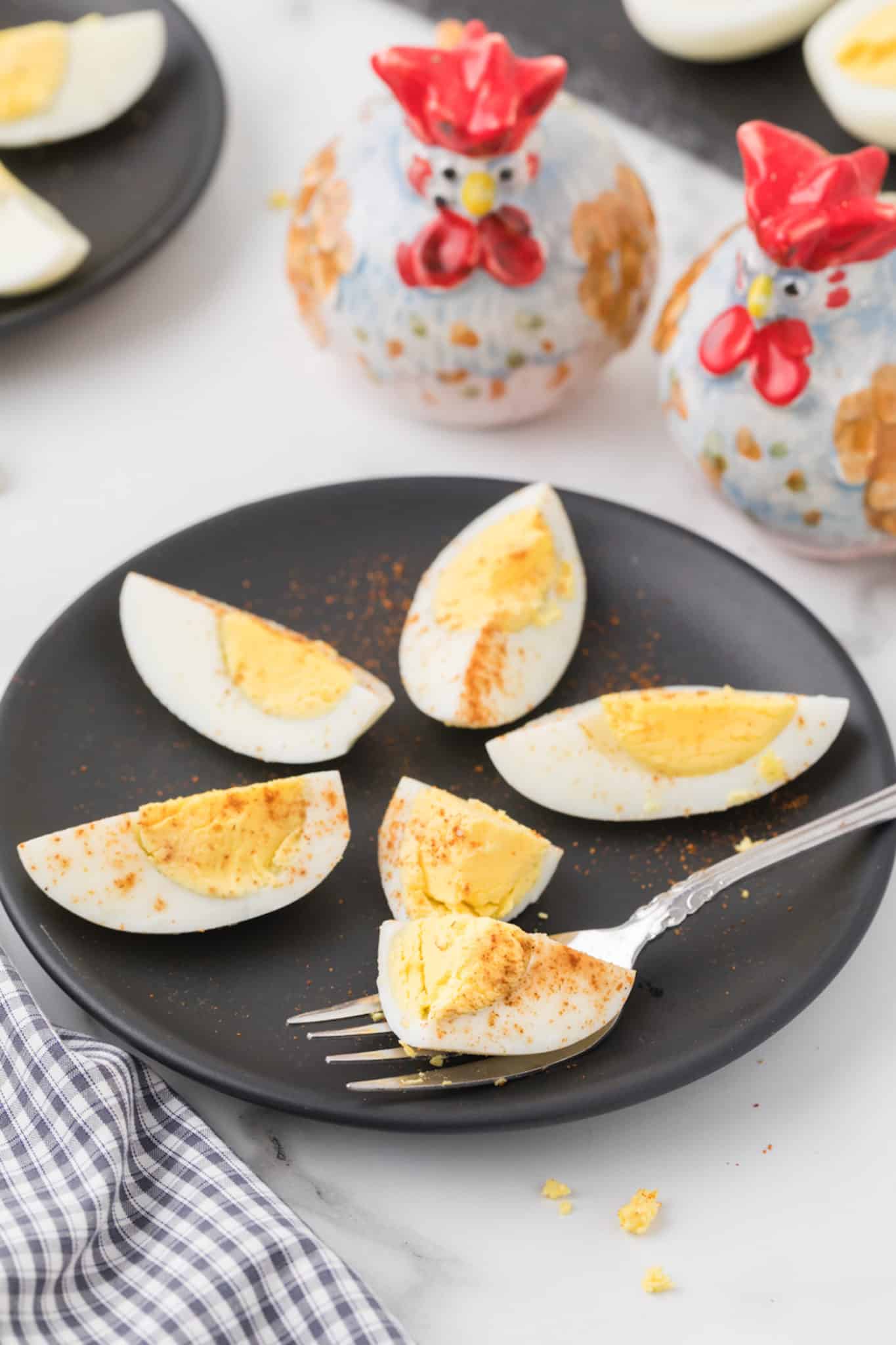 sliced instant pot hard boiled eggs on a plate.