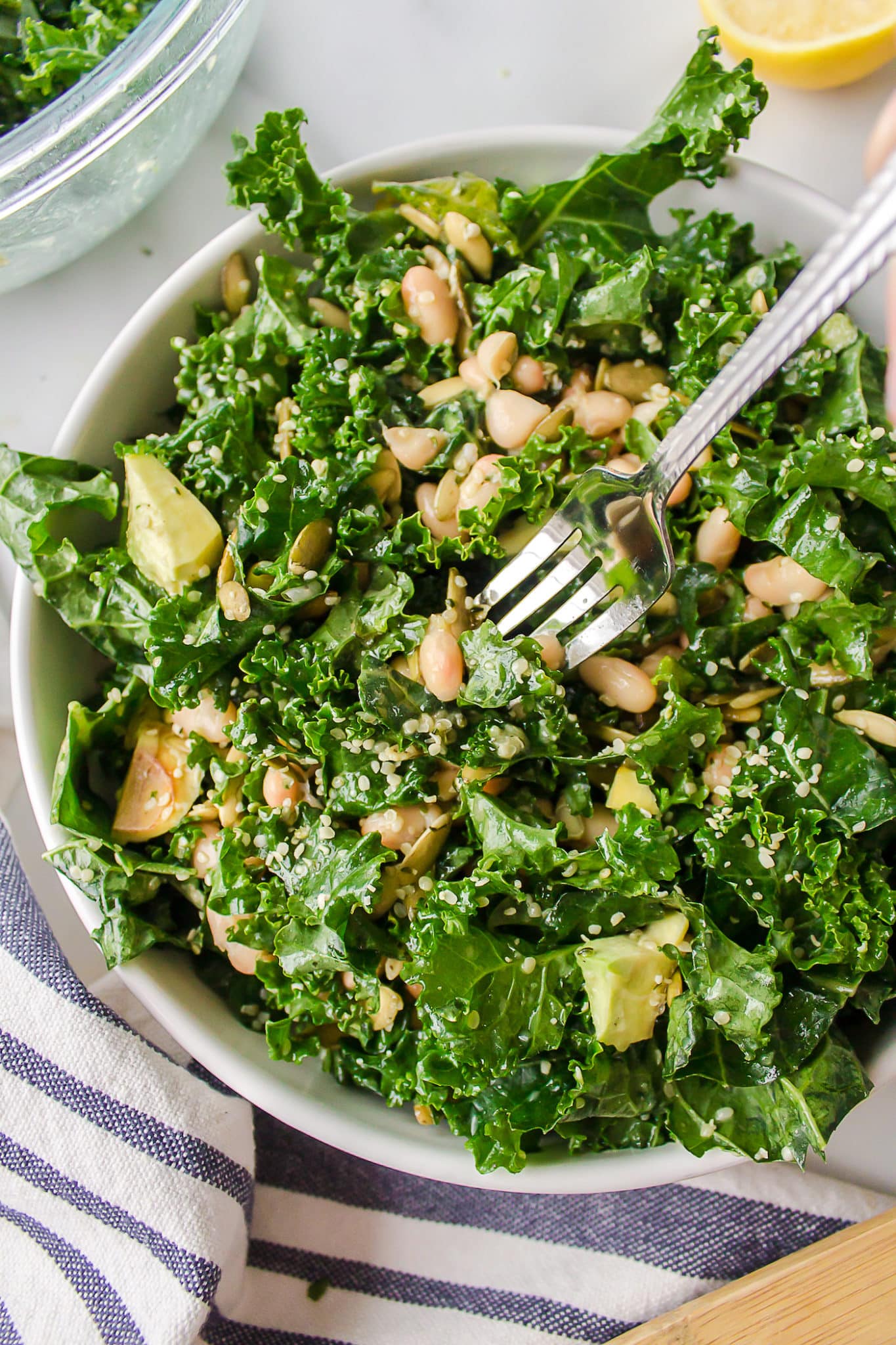 kale salad in a bowl with a fork