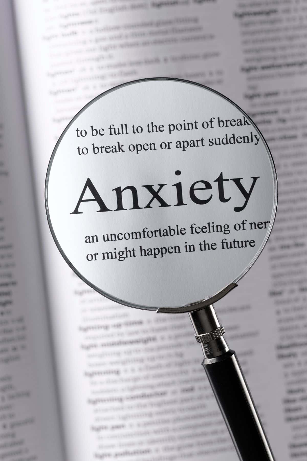 magnifying glass on the word anxiety.