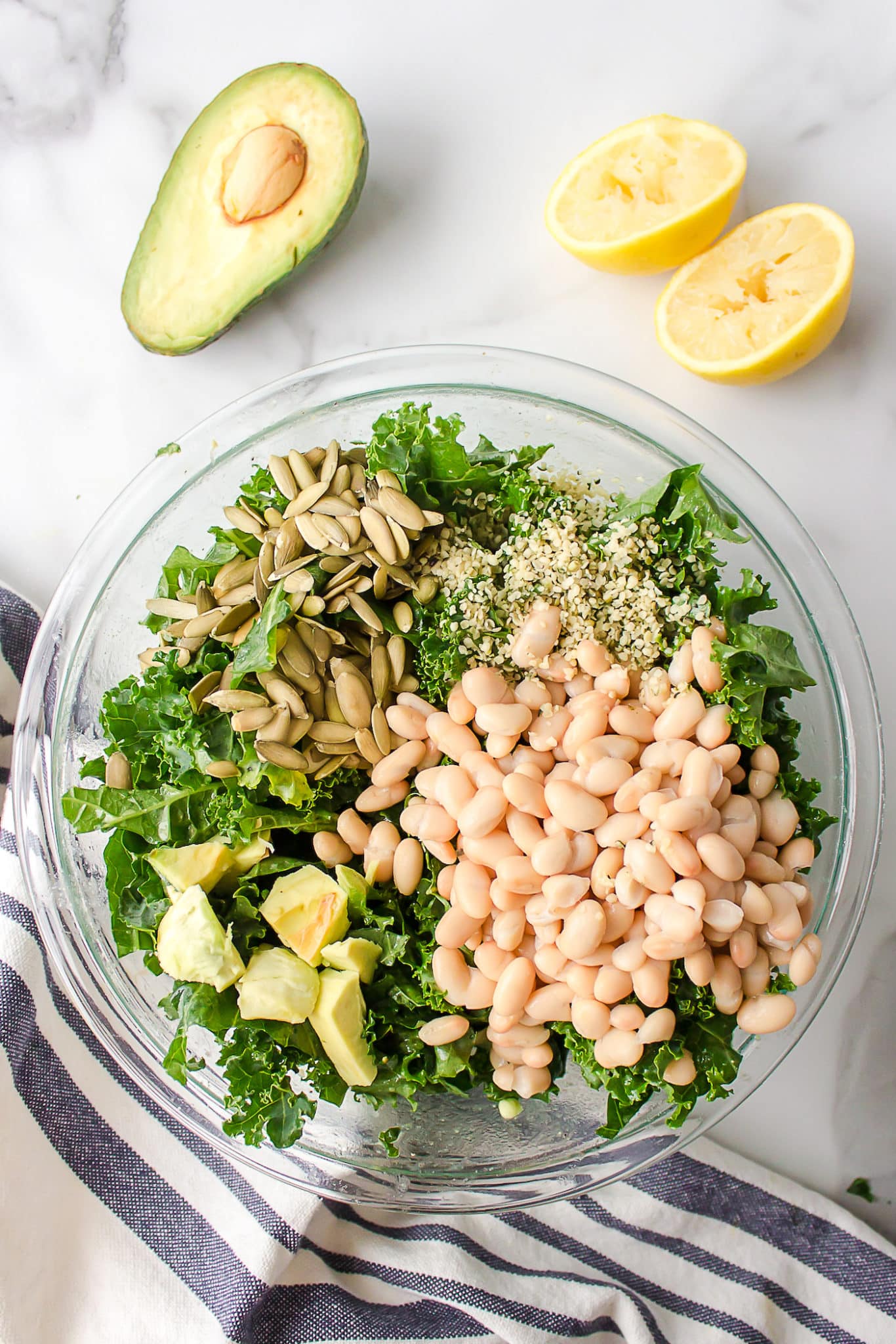 kale with beans, avocado, and pumpkin seeds