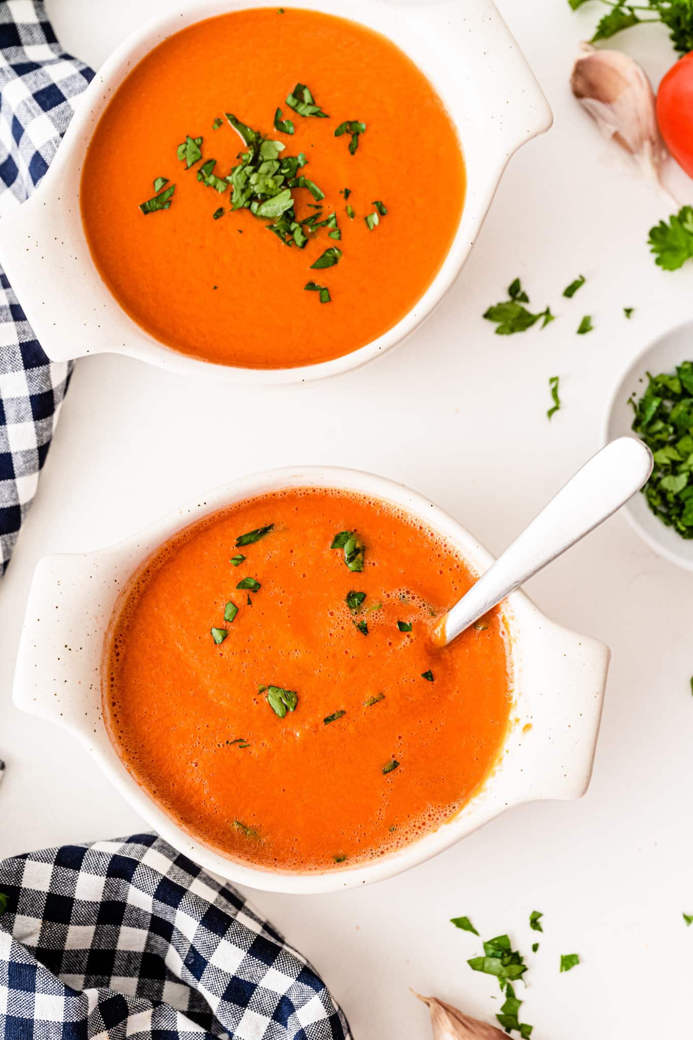 two bowls of tomato soup.