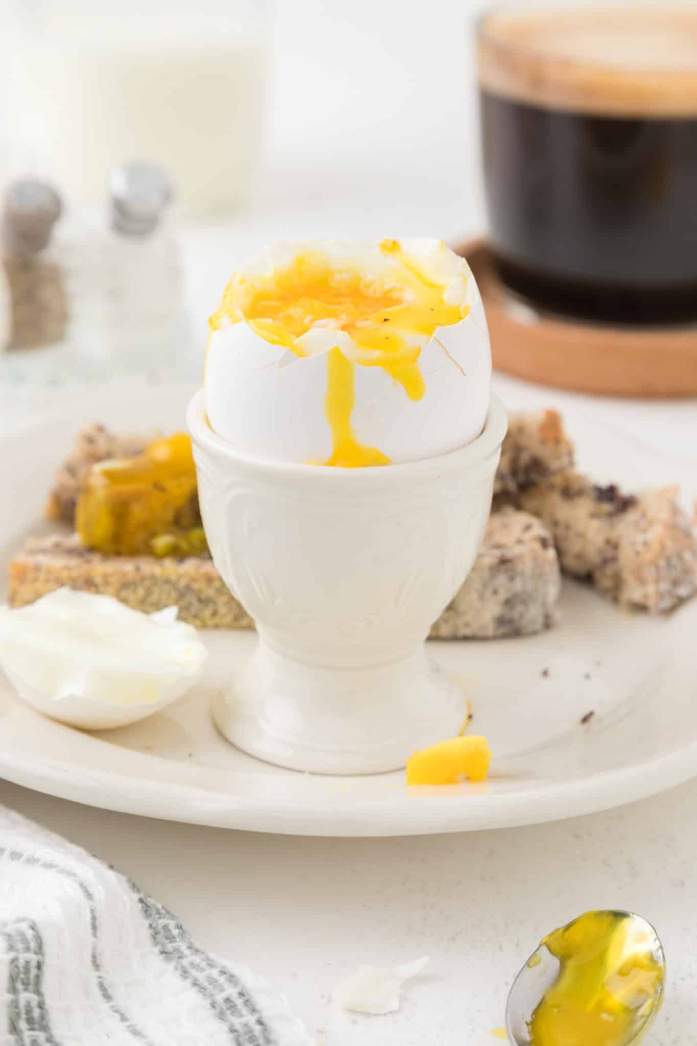 air fried soft boiled egg served in an egg cup.