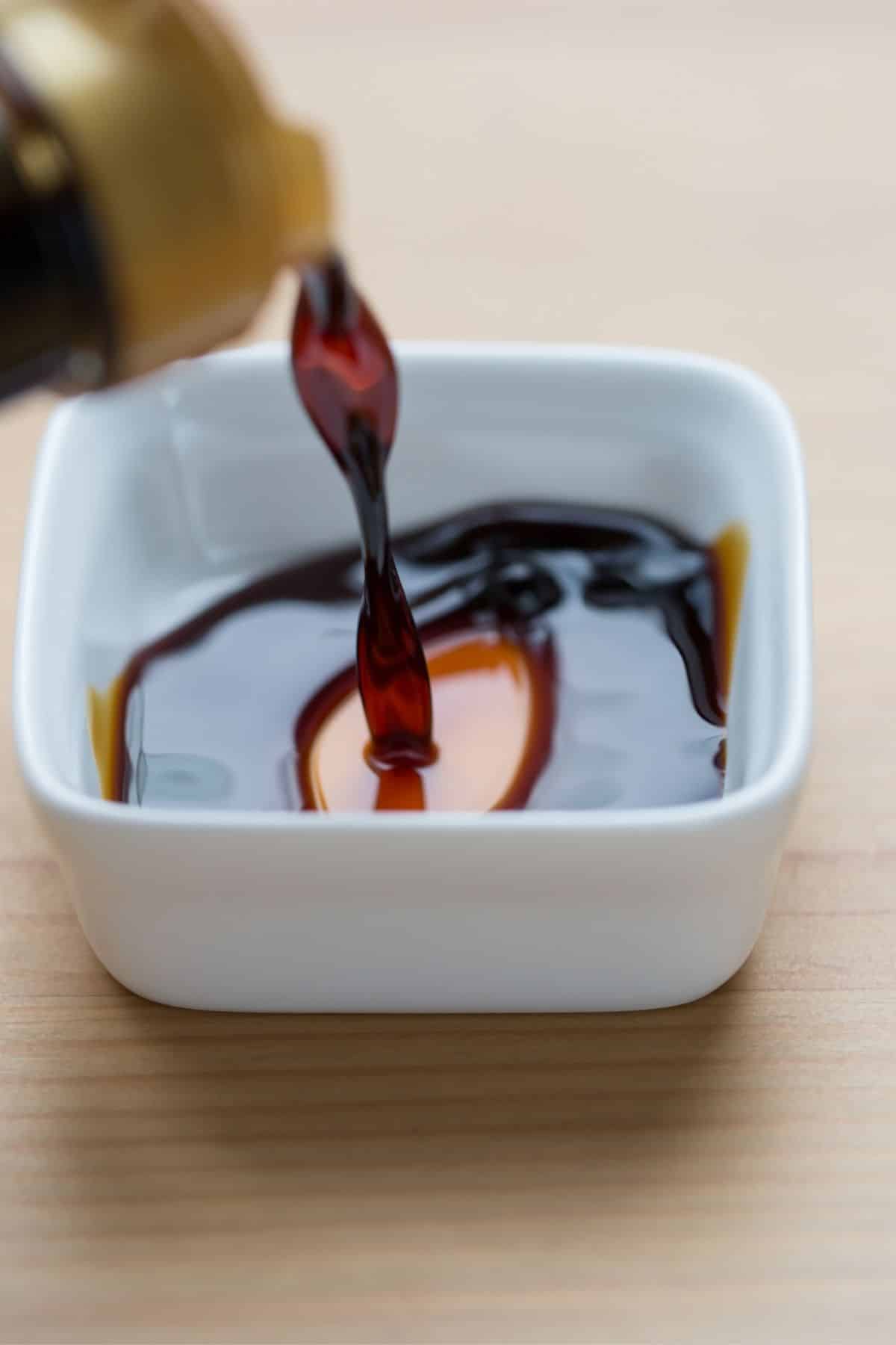 tamari soy sauce poured into a bowl.