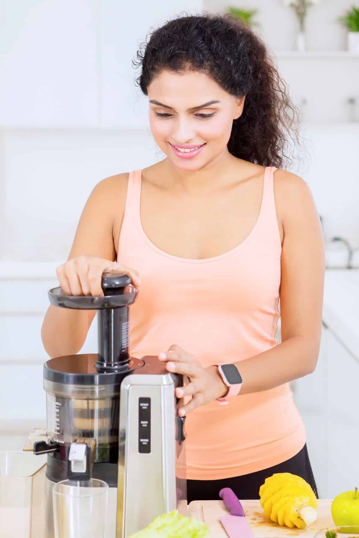 woman using a juicer