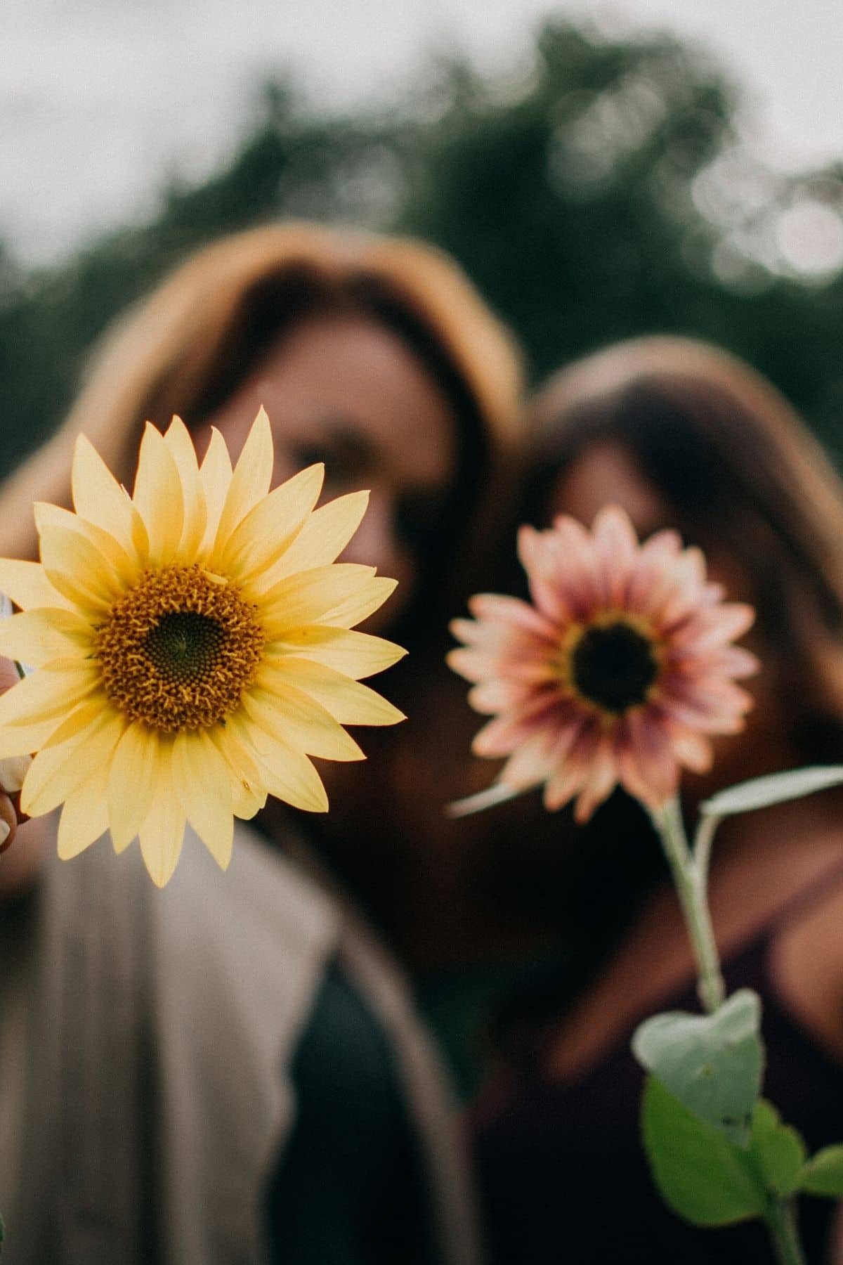 women holding flowers.