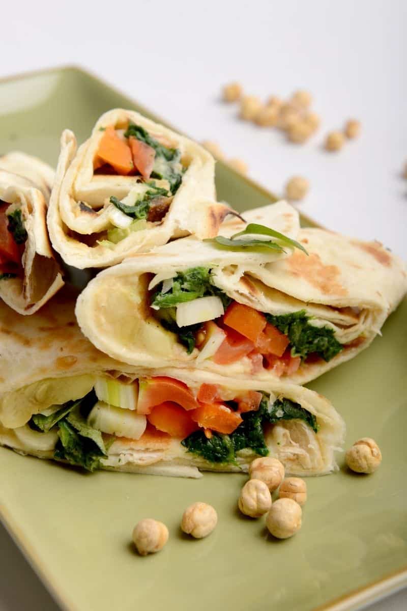 Hummus and vegetables wrapped in flatbread.
