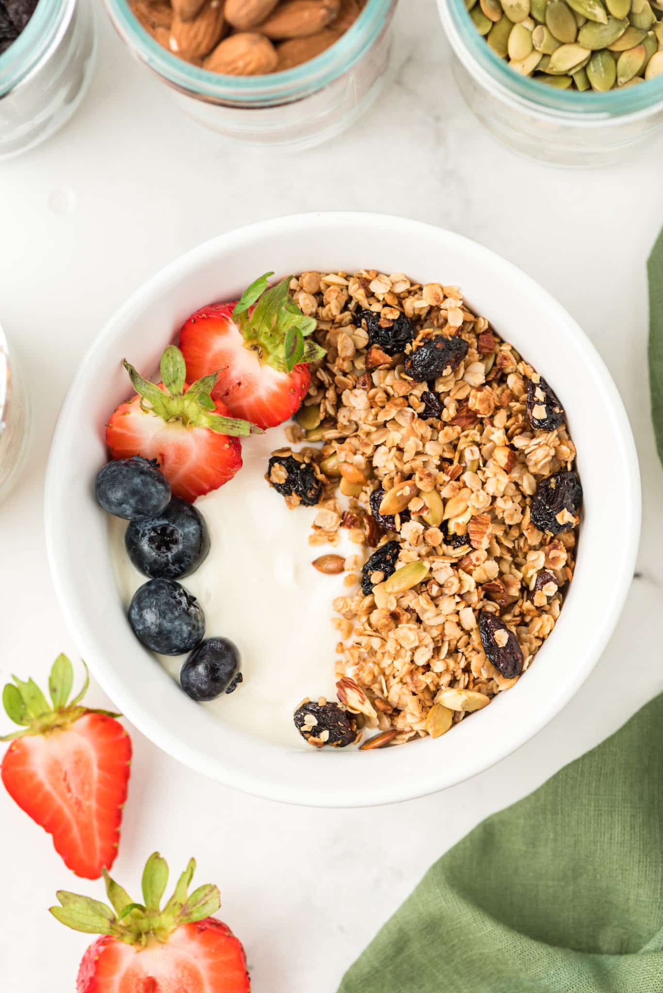 a bowl of yogurt with granola and fresh fruit.