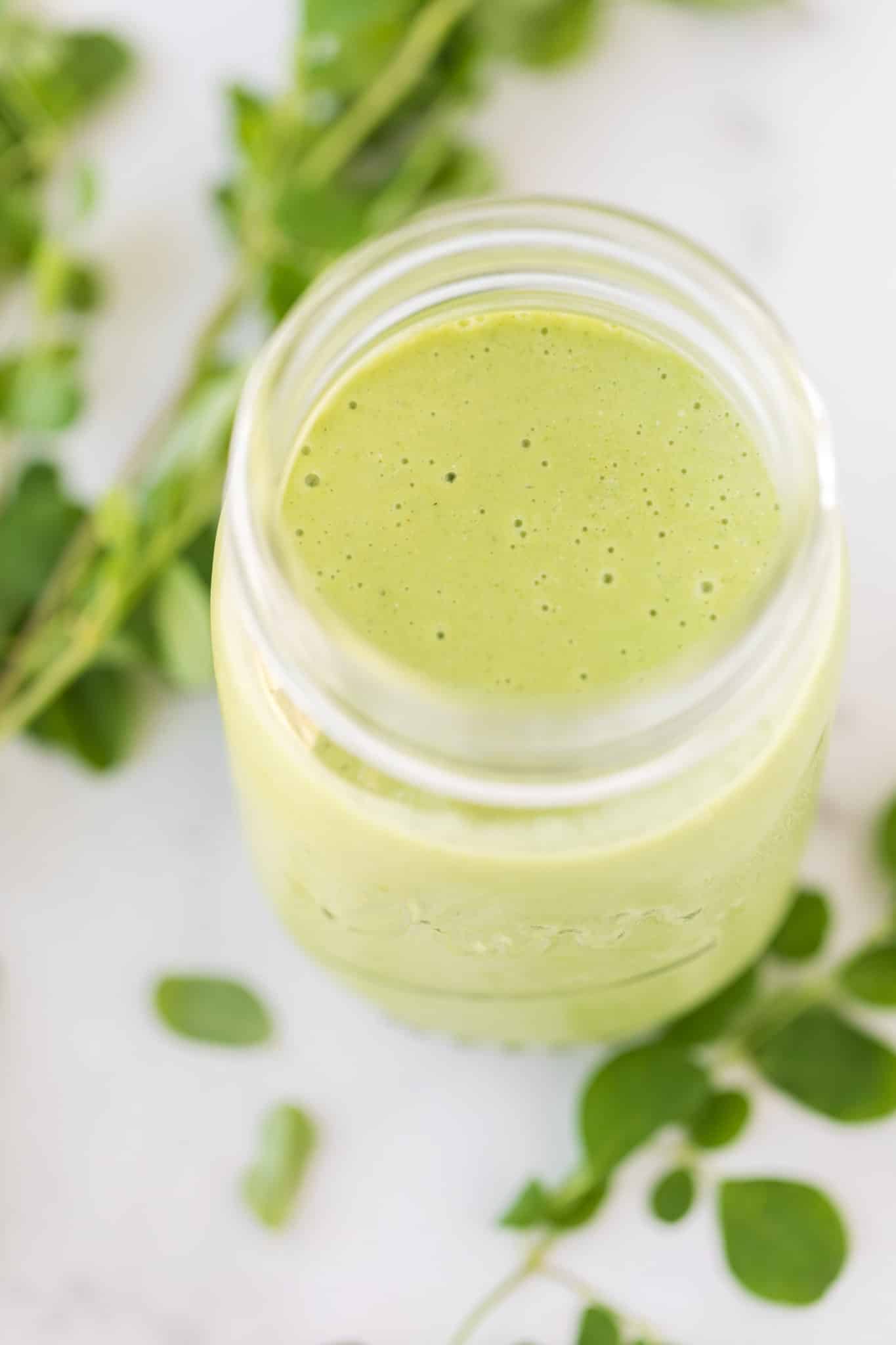 Finished moringa smoothie in a jar.