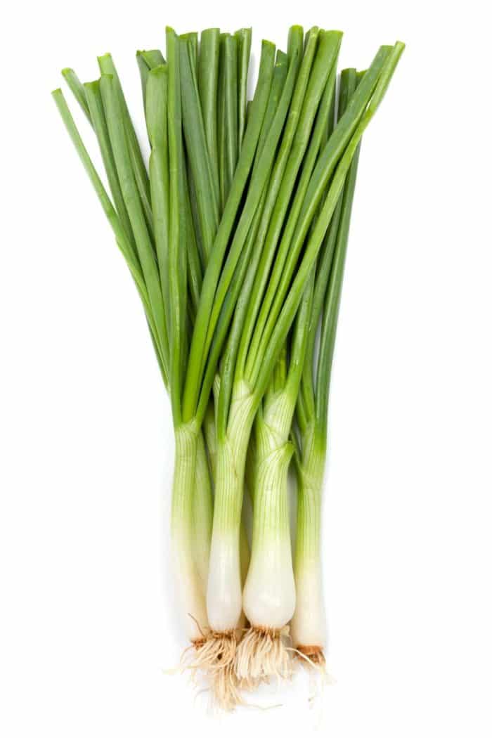 green onions on a table.